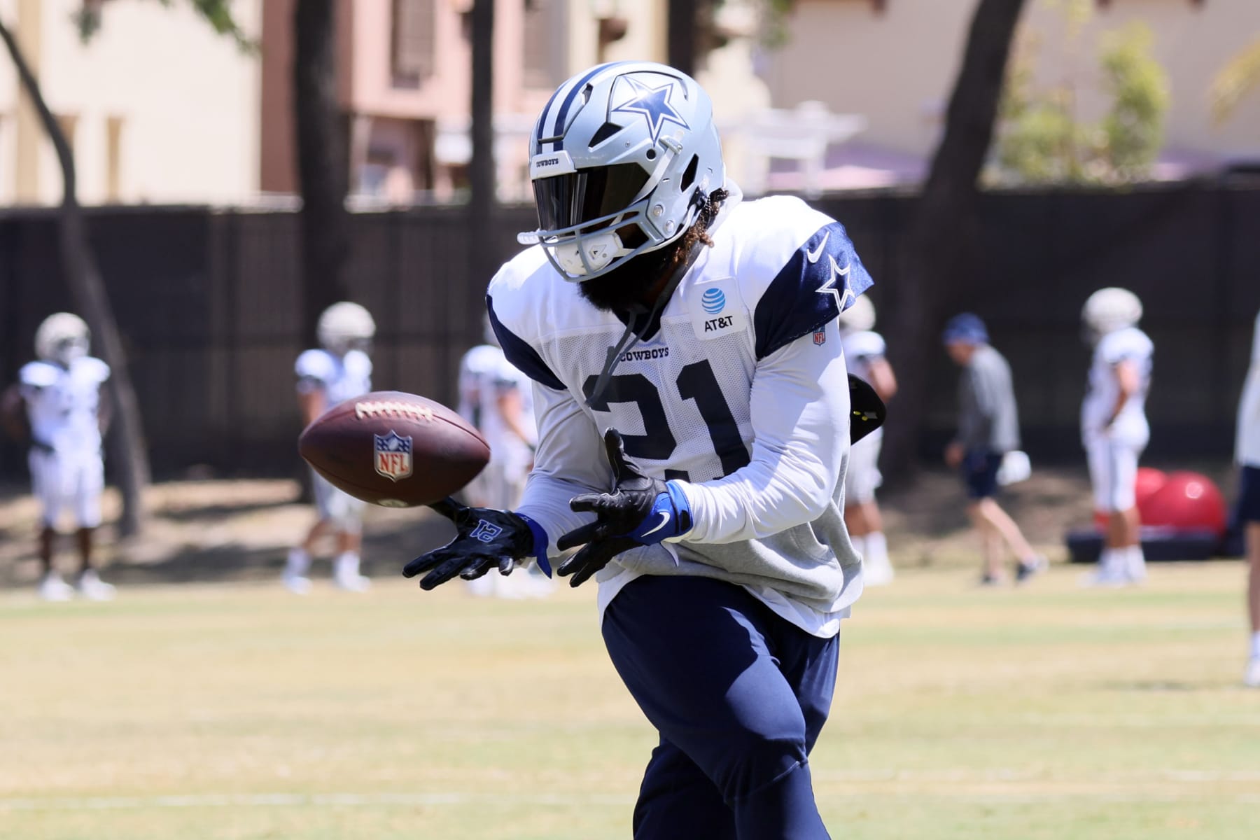 OXNARD, CALIFORNIA - AUGUST 09: Running Back Ezekiel Elliott #21 of the Dallas Cowboys catches the ball during training camp at River Ridge Fields on August 09, 2022 in Oxnard, California. (Photo by Josh Lefkowitz/Getty Images)