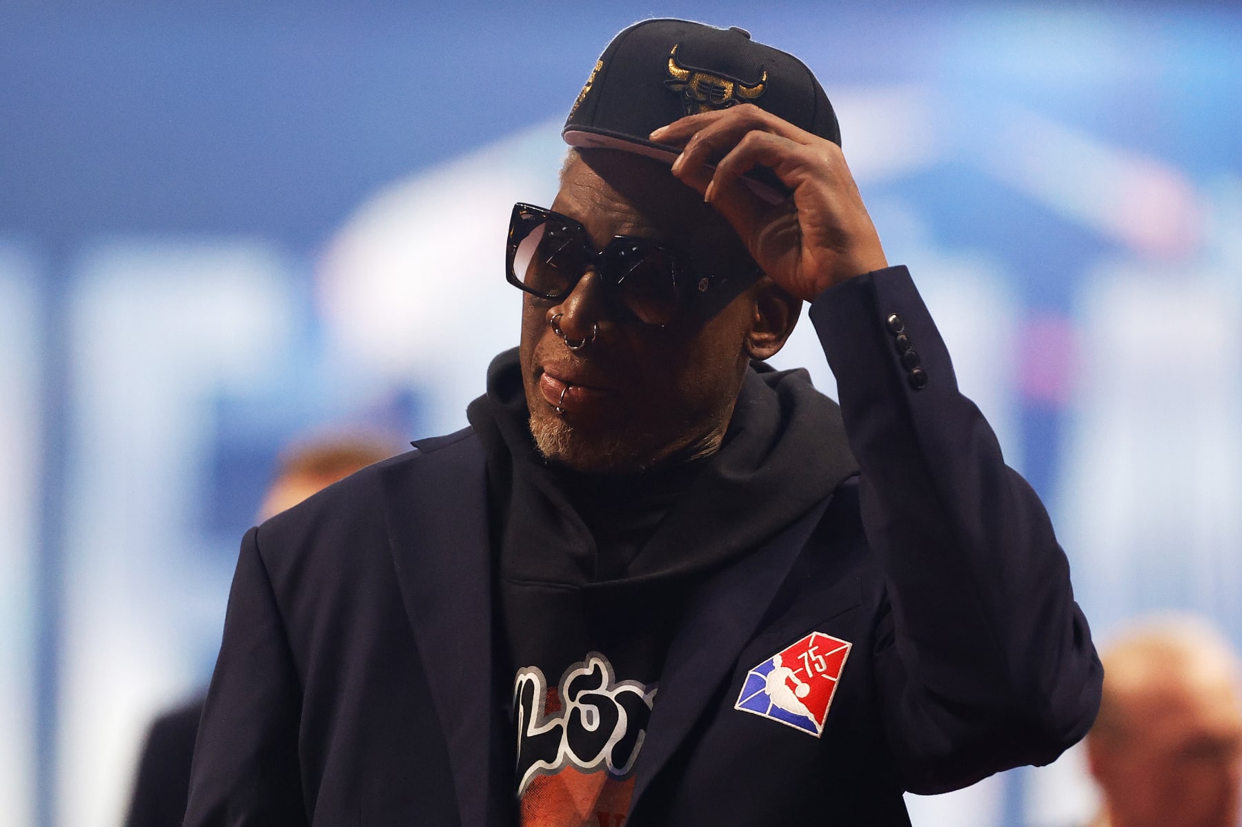 CLEVELAND, OHIO - FEBRUARY 20: Dennis Rodman reacts after being introduced as part of the NBA 75th Anniversary Team during the 2022 NBA All-Star Game at Rocket Mortgage Fieldhouse on February 20, 2022 in Cleveland, Ohio. NOTE TO USER: User expressly acknowledges and agrees that, by downloading and or using this photograph, User is consenting to the terms and conditions of the Getty Images License Agreement. (Photo by Tim Nwachukwu/Getty Images)