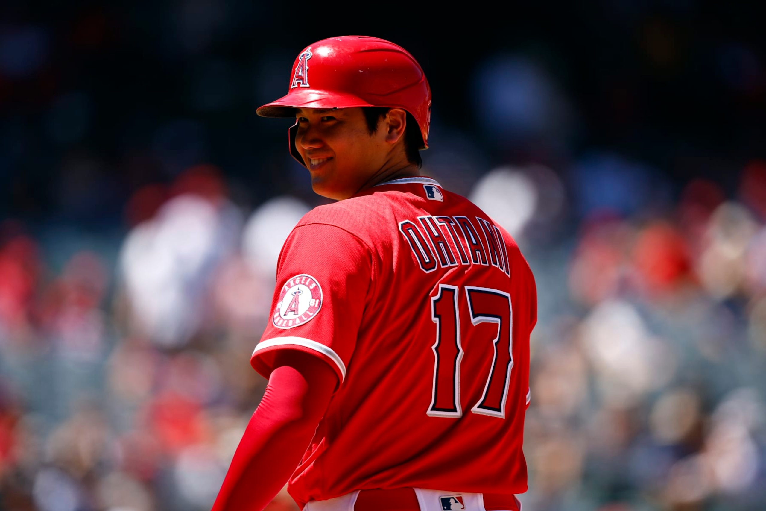 ANAHEIM, CALIFORNIA - AUGUST 14:  Shohei Ohtani #17 of the Los Angeles Angels leads off first base against the Minnesota Twins in the third inning at Angel Stadium of Anaheim on August 14, 2022 in Anaheim, California. (Photo by Ronald Martinez/Getty Images)