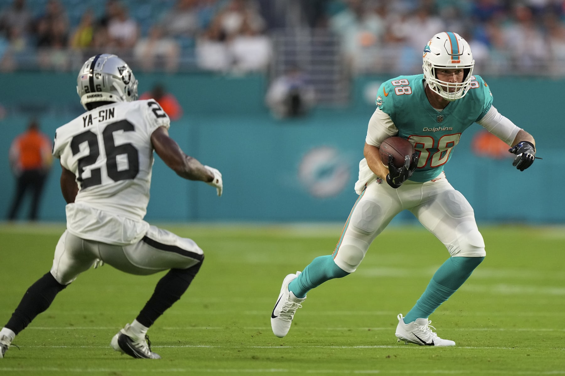 MIAMI GARDENS, FLORIDA - AUGUST 20: Mike Gesicki #88 of the Miami Dolphins heads upfield after making a catch during the second quarter of the preseason game against the Las Vegas Raiders at Hard Rock Stadium on August 20, 2022 in Miami Gardens, Florida. (Photo by Eric Espada/Getty Images)
