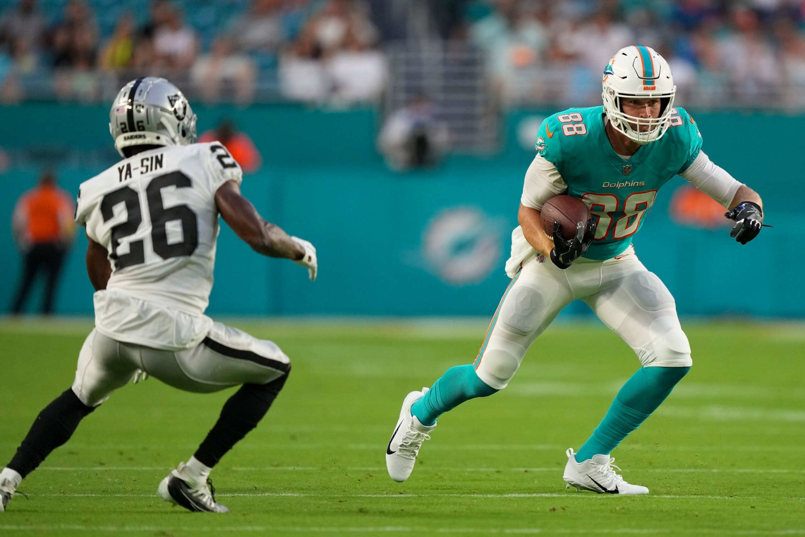 MIAMI GARDENS, FLORIDA - AUGUST 20: Mike Gesicki #88 of the Miami Dolphins heads upfield after making a catch during the second quarter of the preseason game against the Las Vegas Raiders at Hard Rock Stadium on August 20, 2022 in Miami Gardens, Florida. (Photo by Eric Espada/Getty Images)