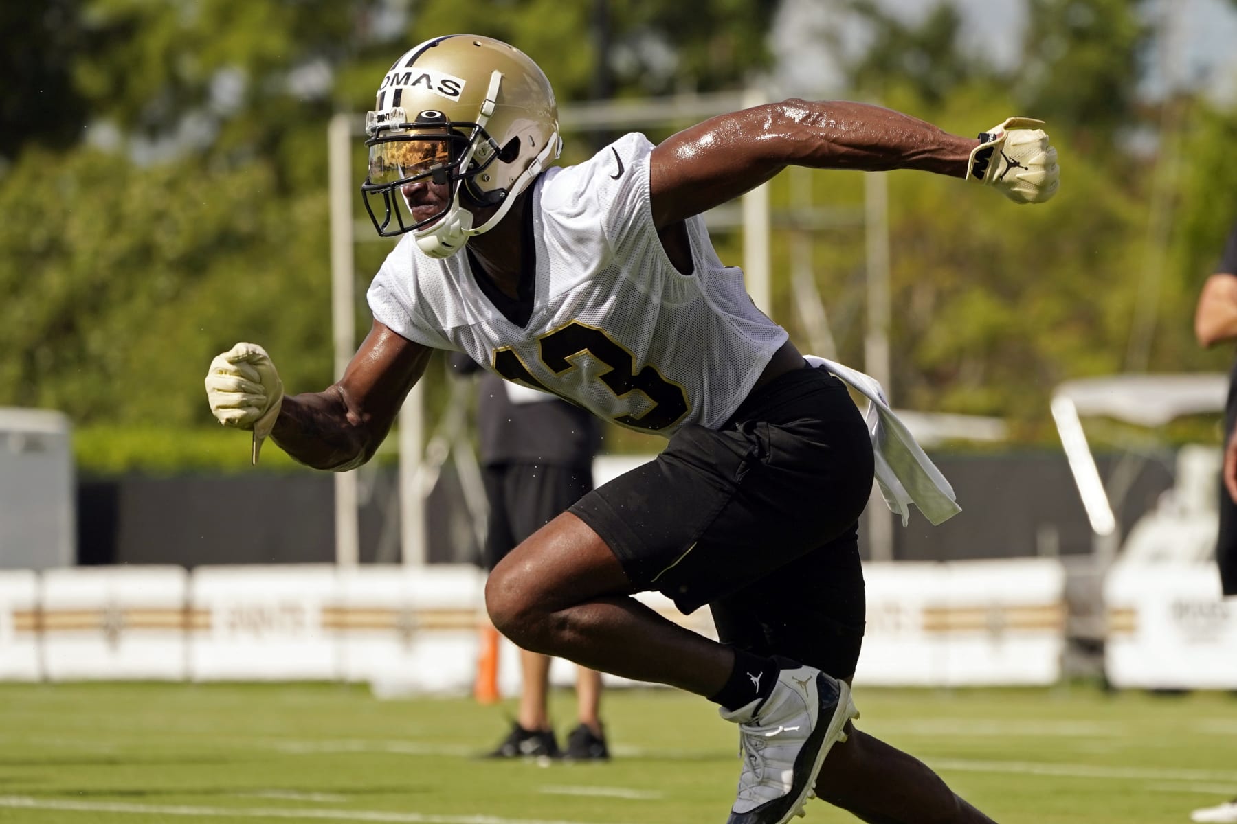 New Orleans Saints wide receiver Michael Thomas (13) runs a route during the NFL football team's training camp in Metairie, La., Wednesday, July 27, 2022. (AP Photo/Gerald Herbert)