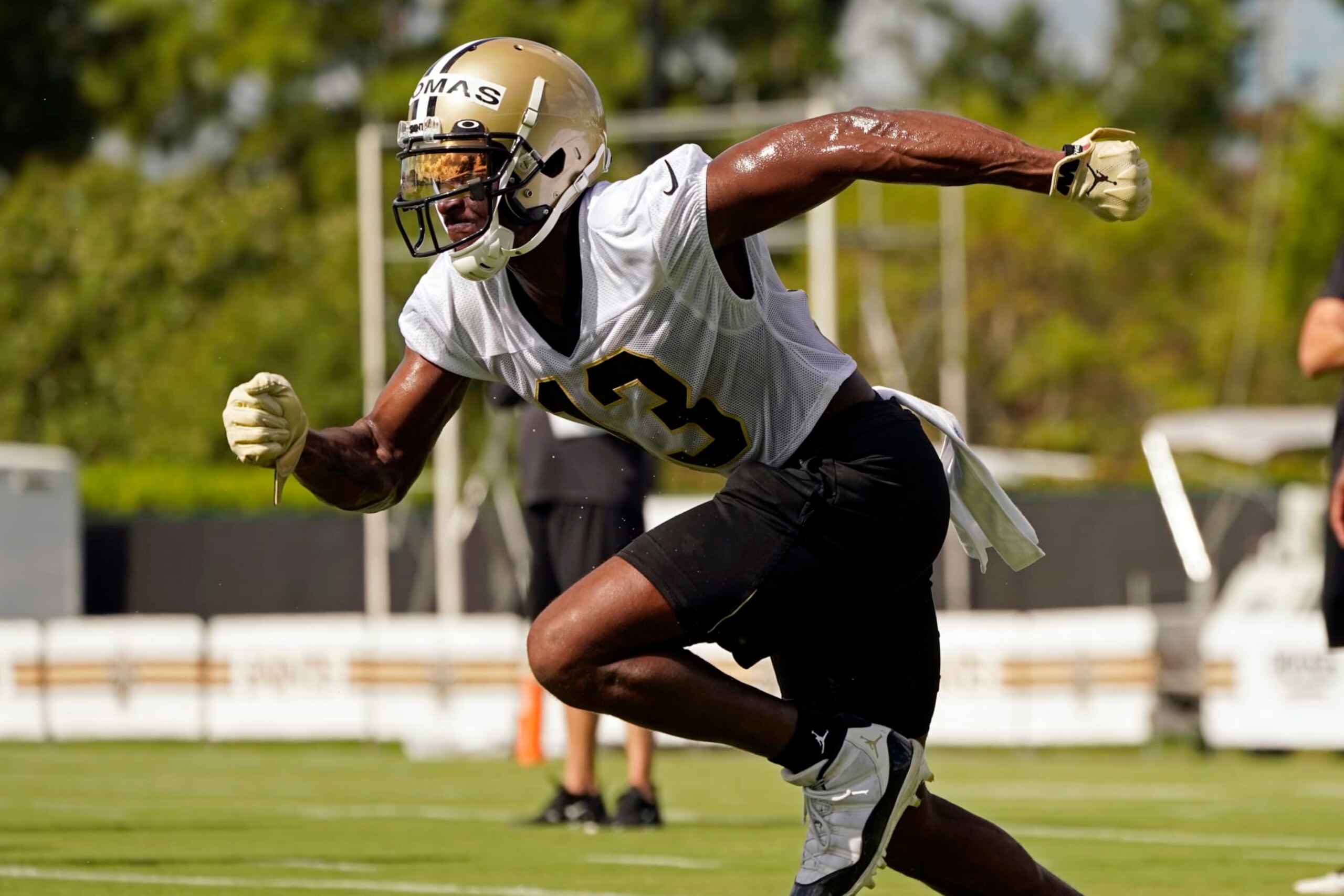 New Orleans Saints wide receiver Michael Thomas (13) runs a route during the NFL football team's training camp in Metairie, La., Wednesday, July 27, 2022. (AP Photo/Gerald Herbert)