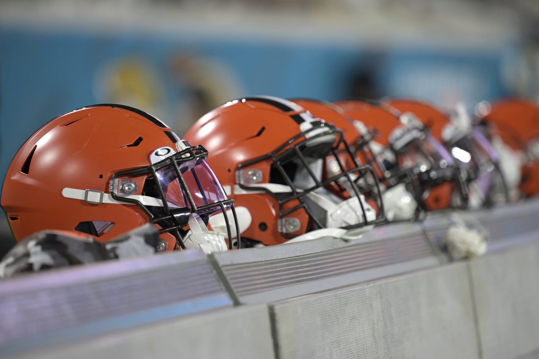 Cleveland Browns helmets are viewed sitting behind the bench during the first half of a preseason NFL football game against the Jacksonville Jaguars, Friday, Aug. 12, 2022, in Jacksonville, Fla. (AP Photo/Phelan M. Ebenhack)