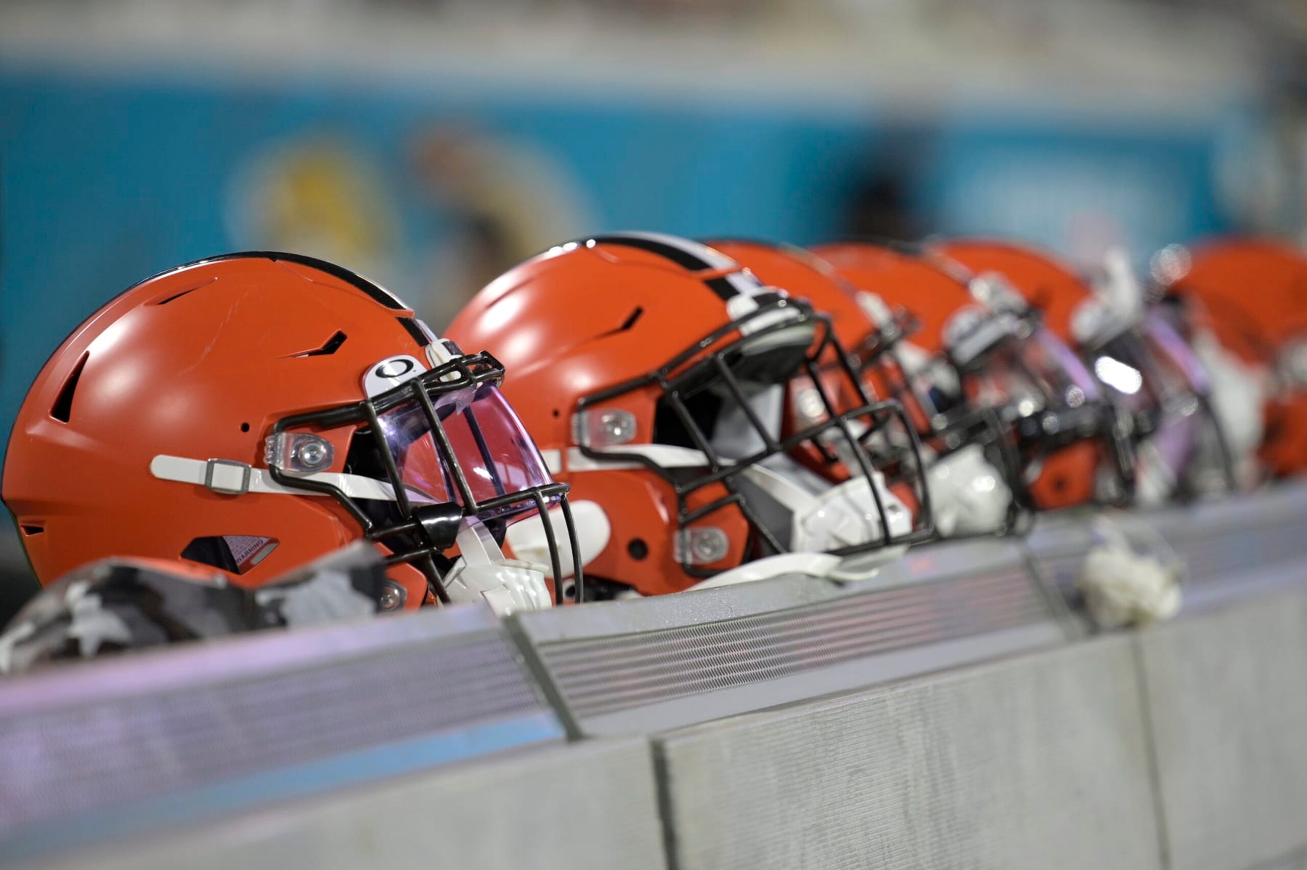 Cleveland Browns helmets are viewed sitting behind the bench during the first half of a preseason NFL football game against the Jacksonville Jaguars, Friday, Aug. 12, 2022, in Jacksonville, Fla. (AP Photo/Phelan M. Ebenhack)