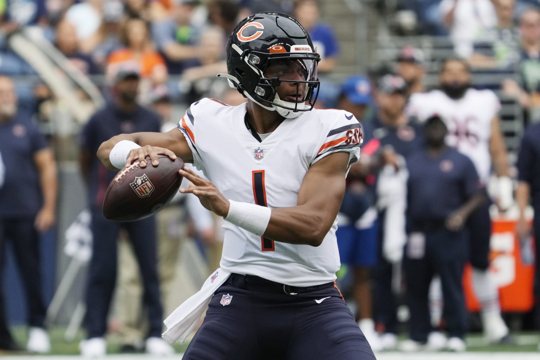 Chicago Bears quarterback Justin Fields passes during the first half of a preseason NFL football game against the Seattle Seahawks, Thursday, Aug. 18, 2022, in Seattle. (AP Photo/Stephen Brashear)