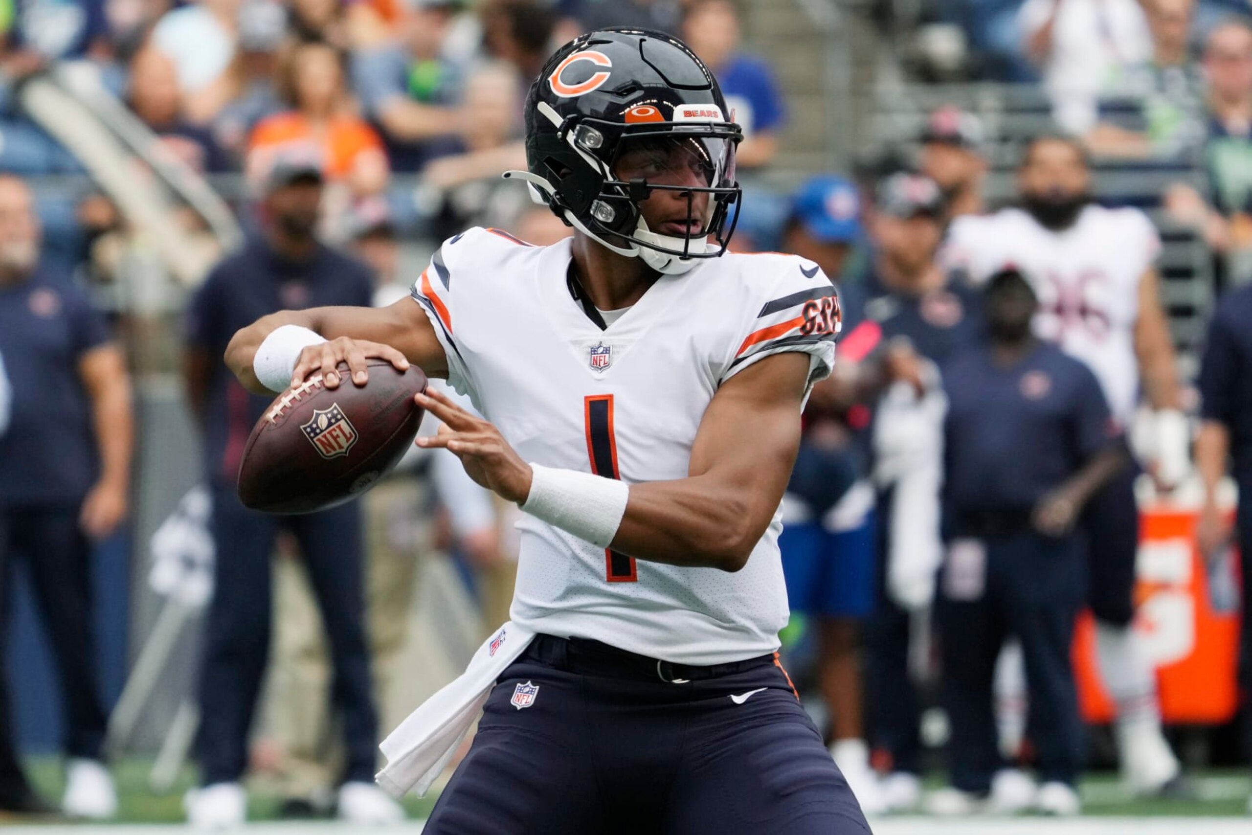 Chicago Bears quarterback Justin Fields passes during the first half of a preseason NFL football game against the Seattle Seahawks, Thursday, Aug. 18, 2022, in Seattle. (AP Photo/Stephen Brashear)