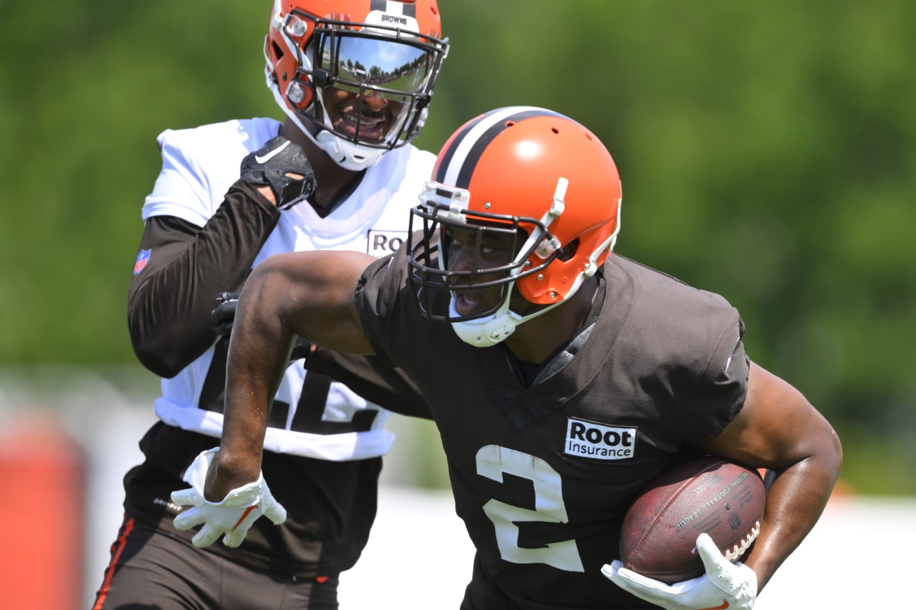 Cleveland Browns wide receiver Amari Cooper runs after a catch next to Grant Delpit during the NFL football team's training camp Wednesday, Aug. 3, 2022, in Berea, Ohio. (AP Photo/David Richard)