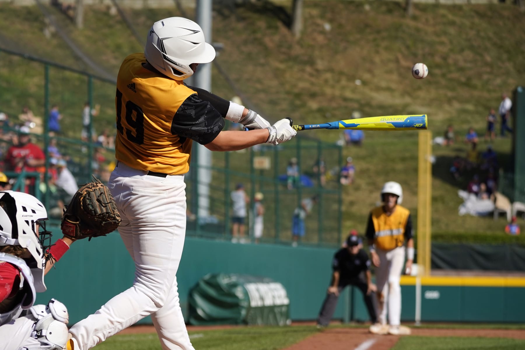 Nolensville, Tenn.'s Wright Martin hits a sacrifice fly, scoring Jack Rhodes from third, during the fifth inning of a baseball game against Santa Clara, Utah, at the Little League World Series in South Williamsport, Pa., Friday, Aug. 19, 2022. Tennessee won 11-2. (AP Photo/Gene J. Puskar)