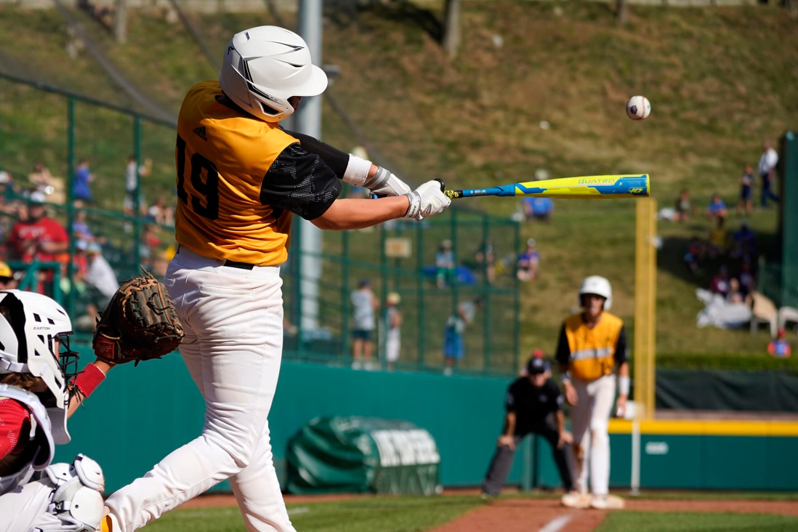 Nolensville, Tenn.'s Wright Martin hits a sacrifice fly, scoring Jack Rhodes from third, during the fifth inning of a baseball game against Santa Clara, Utah, at the Little League World Series in South Williamsport, Pa., Friday, Aug. 19, 2022. Tennessee won 11-2. (AP Photo/Gene J. Puskar)