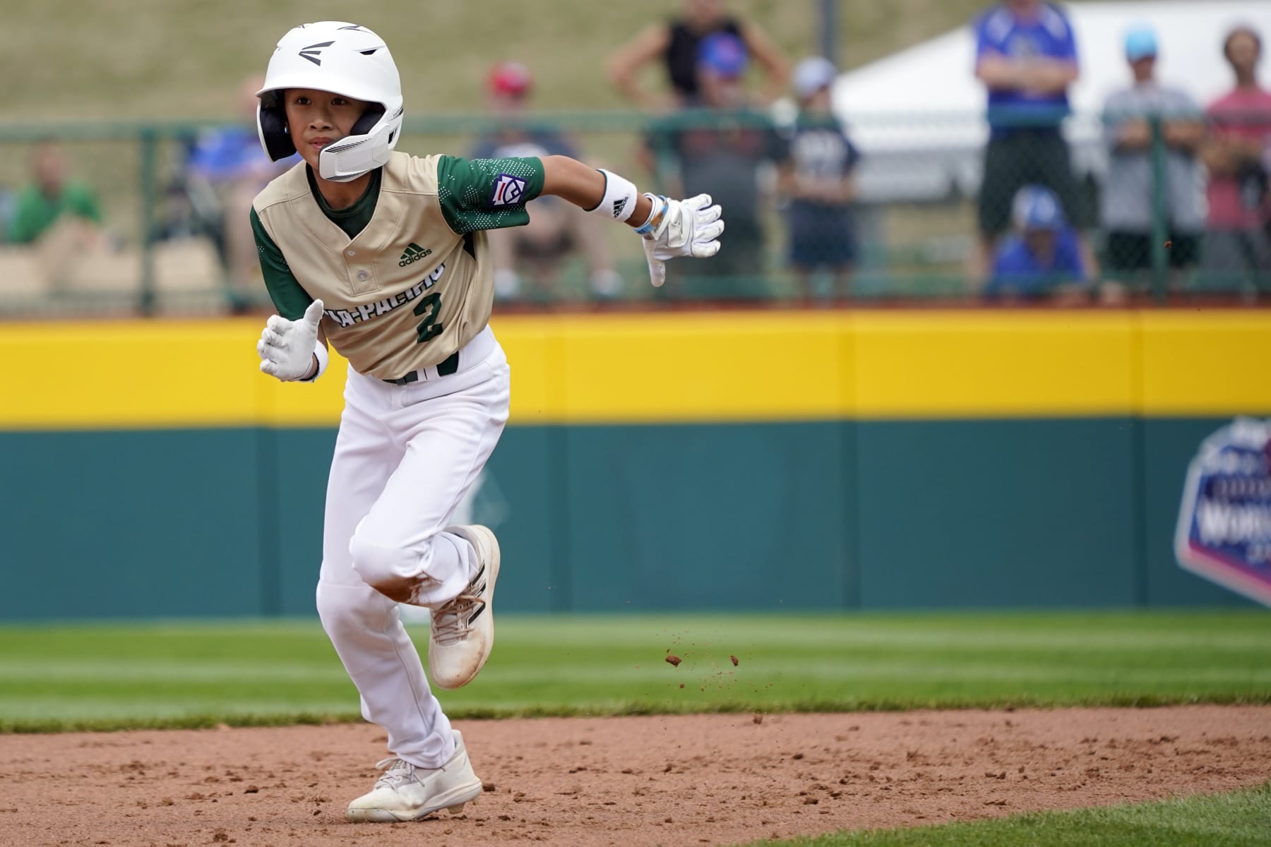 Taiwan's Mai Yi-Chen (2) rounds second base against Italy during the second inning of a baseball game at the Little League World Series tournament in South Williamsport, Pa., Thursday, Aug. 18, 2022. (AP Photo/Tom E. Puskar)