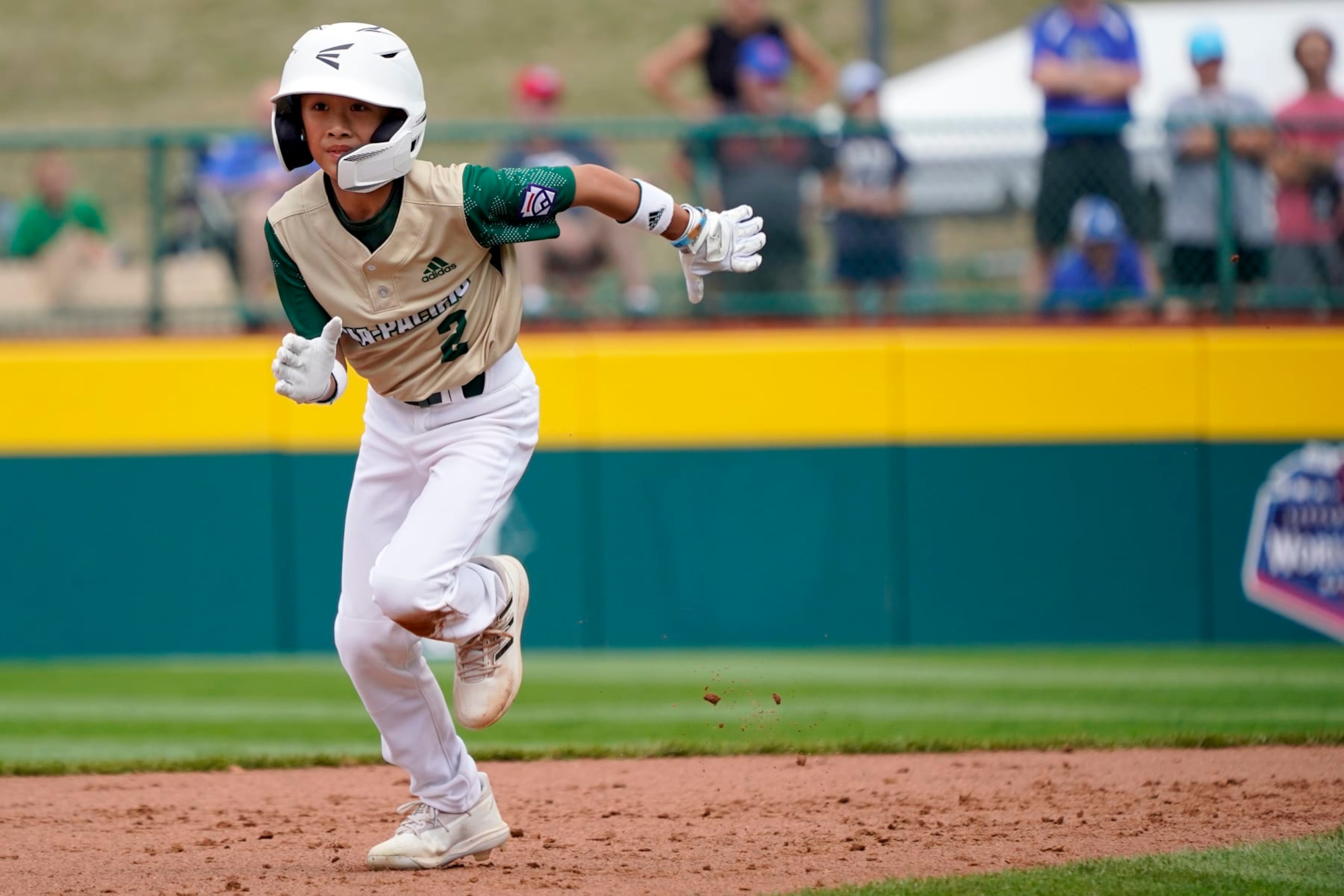 Taiwan's Mai Yi-Chen (2) rounds second base against Italy during the second inning of a baseball game at the Little League World Series tournament in South Williamsport, Pa., Thursday, Aug. 18, 2022. (AP Photo/Tom E. Puskar)