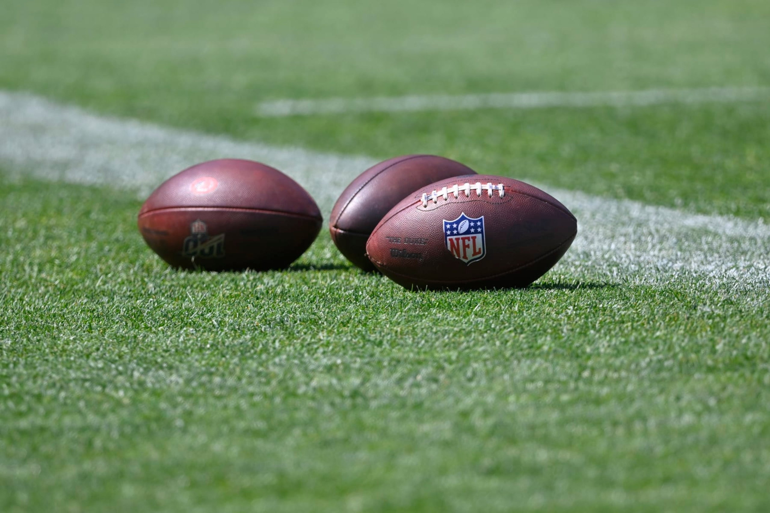 Footballs sit on the field during an NFL football practice at the team's training facility Wednesday, June 1, 2022, in Berea, Ohio. (AP Photo/David Richard) Footballs sit on the field during an NFL football practice at the team's training facility Wednesday, June 1, 2022, in Berea, Ohio. (AP Photo/David Richard)