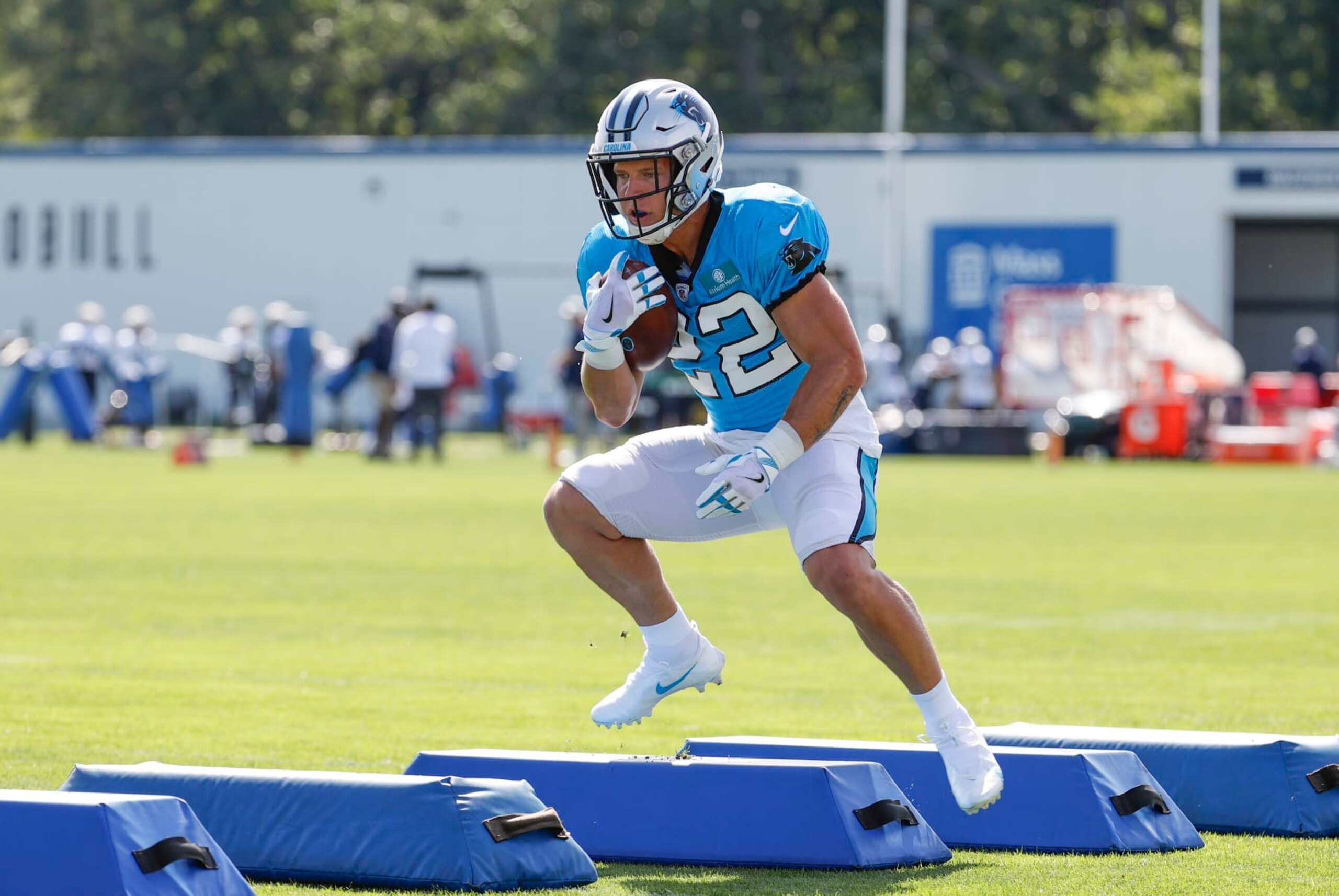 FOXBOROUGH, MA - AUGUST 16: Carolina Panthers running back Christian McCaffrey (22) runs the speed bumps during a joint practice between the New England Patriots and the Carolina Panthers on August 16, 2022, at the Patriots Practice Facility at Gillette Stadium in Foxborough, Massachusetts. (Photo by Fred Kfoury III/Icon Sportswire via Getty Images)