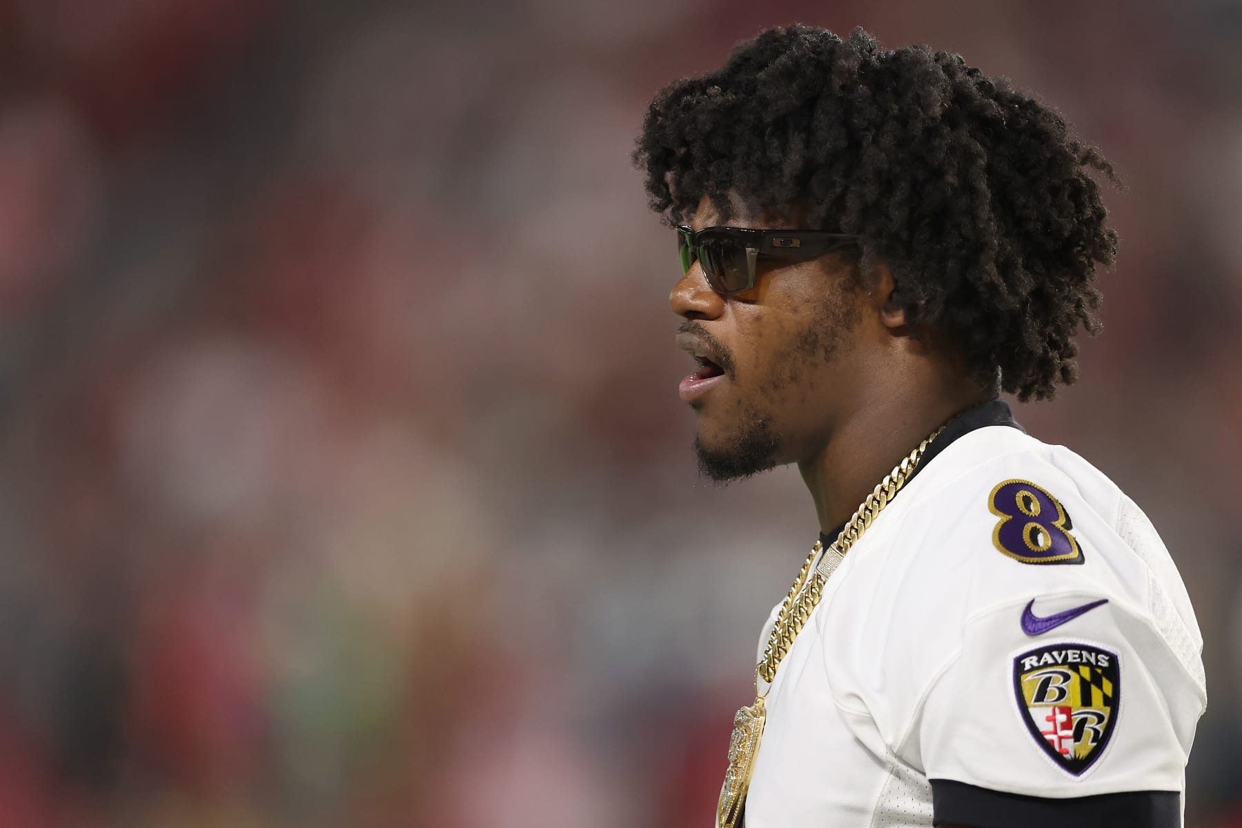 GLENDALE, ARIZONA - AUGUST 21: Quarterback Lamar Jackson #8 of the Baltimore Ravens on the sidelines during the first half of the NFL preseason game against the Arizona Cardinals at State Farm Stadium on August 21, 2022 in Glendale, Arizona. The Ravens defeated the Cardinals 24-17. (Photo by Christian Petersen/Getty Images)