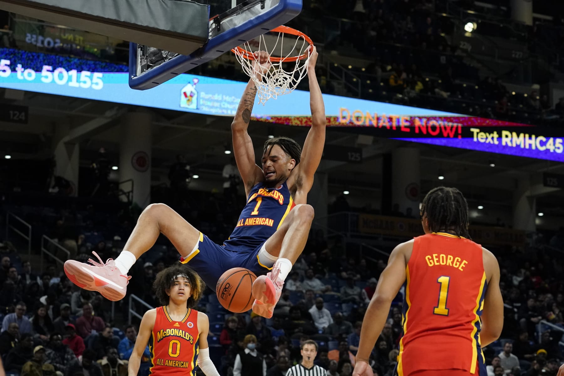 East boy's Dereck Lively dunks the ball in the second half of the McDonald's All-American Boys basketball game against the West team Tuesday, March 29, 2022, in Chicago. The East won 102-75. (AP Photo/Charles Rex Arbogast)