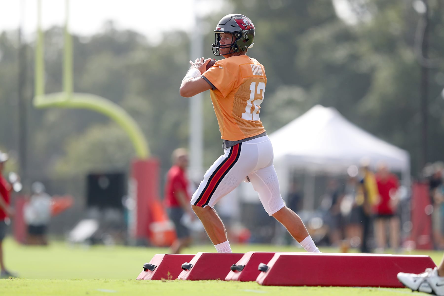 TAMPA, FL - AUG 10: Tampa Bay Buccaneers quarterback Tom Brady (12) goes thru a drill during the Tampa Bay Buccaneers & Miami Dolphins Joint-Practice on August 10, 2022 at the AdventHealth Training Center at One Buccaneer Place in Tampa, Florida. (Photo by Cliff Welch/Icon Sportswire via Getty Images)