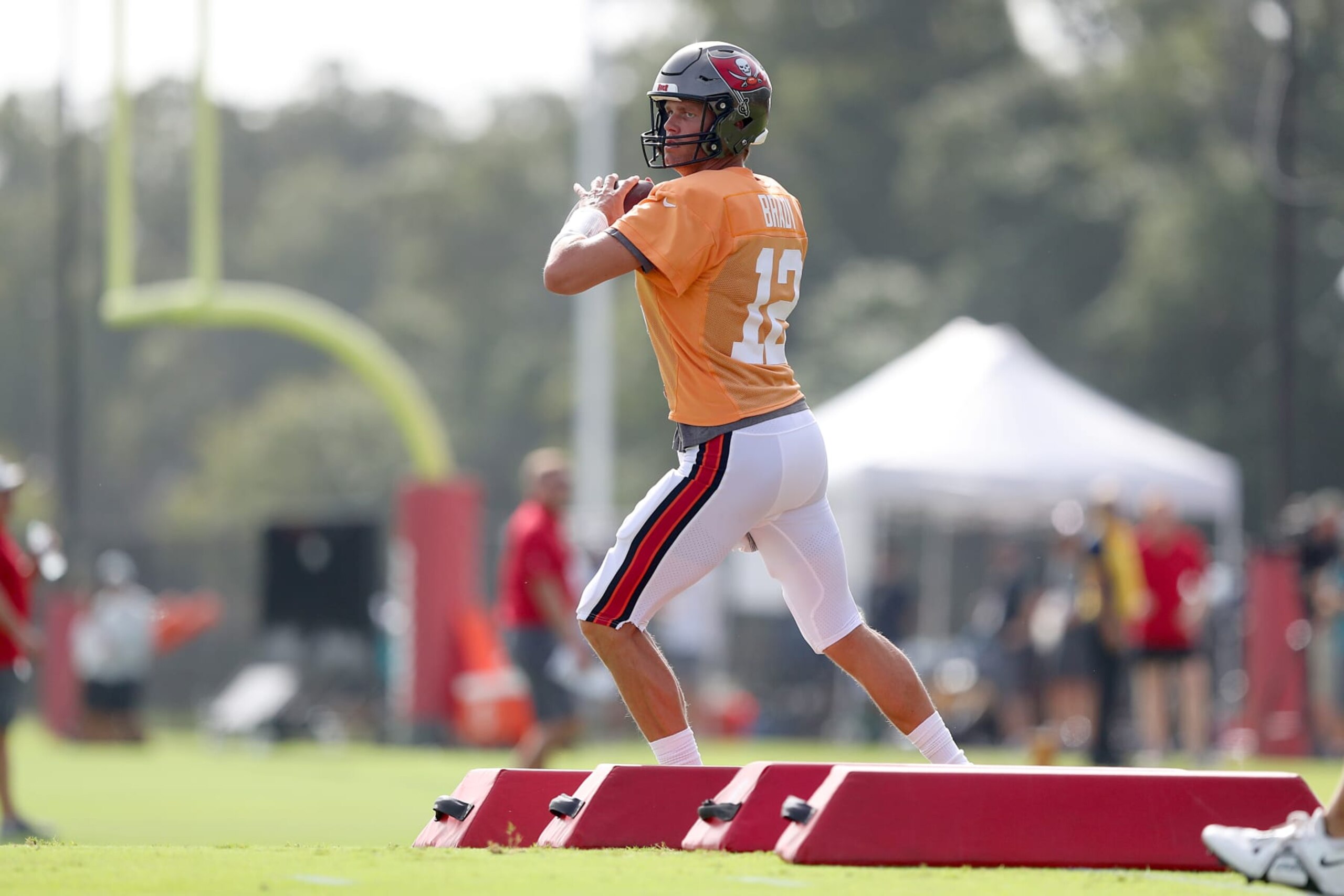 TAMPA, FL - AUG 10: Tampa Bay Buccaneers quarterback Tom Brady (12) goes thru a drill during the Tampa Bay Buccaneers & Miami Dolphins Joint-Practice on August 10, 2022 at the AdventHealth Training Center at One Buccaneer Place in Tampa, Florida. (Photo by Cliff Welch/Icon Sportswire via Getty Images)