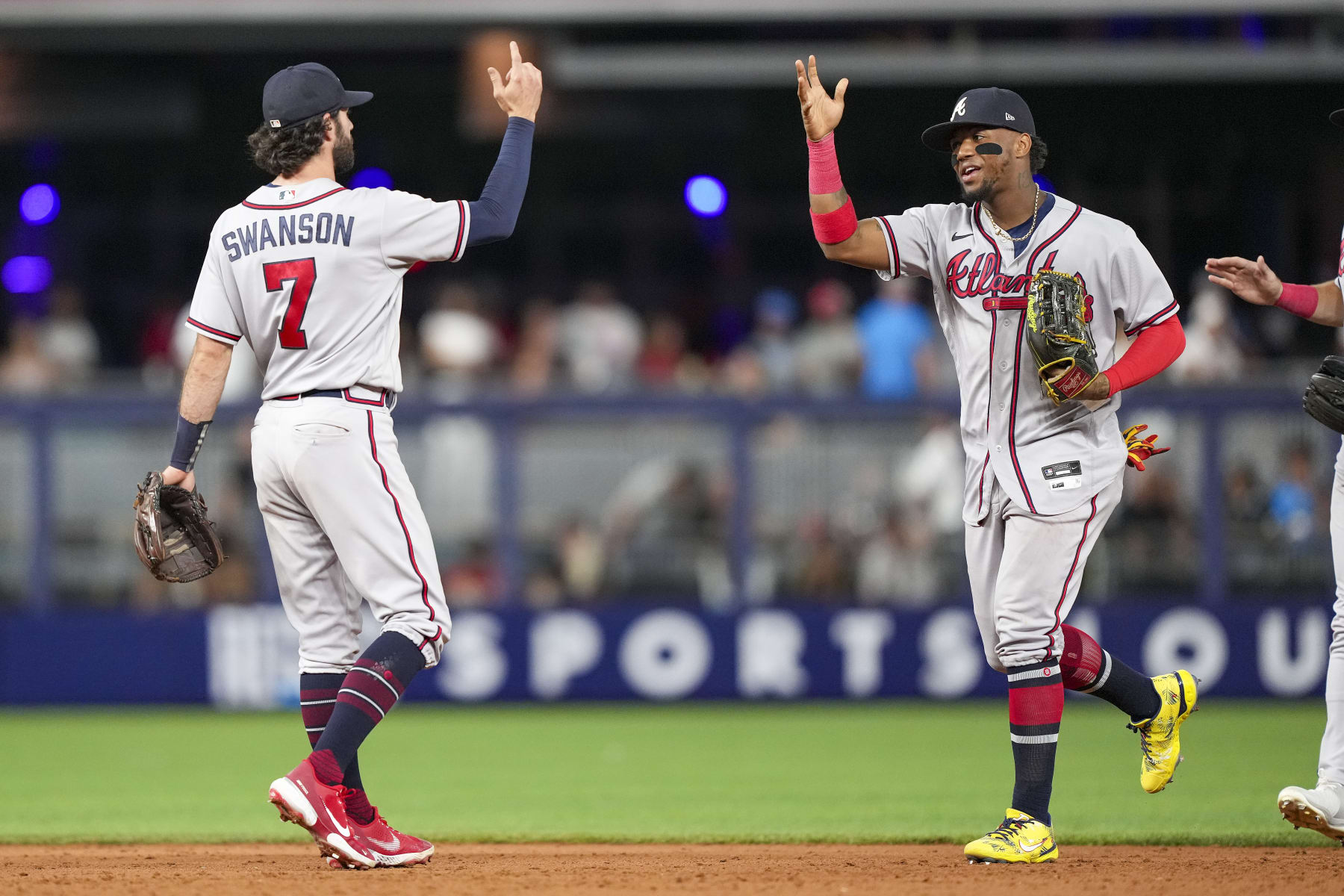 MIAMI, FLORIDA - AUGUST 12: Dansby Swanson #7 of the Atlanta Braves celebrates with Ronald Acuna Jr. #13 after defeating the Miami Marlins at loanDepot park on August 12, 2022 in Miami, Florida. (Photo by Eric Espada/Getty Images)