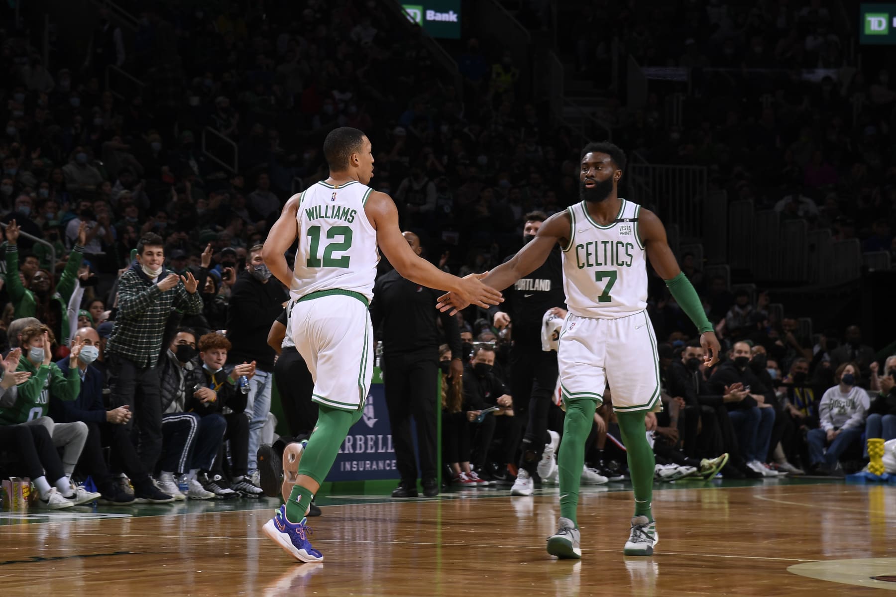 BOSTON, MA - JANUARY 21: Grant Williams #12 and Jaylen Brown #7 of the Boston Celtics embrace during the game against the Portland Trail Blazers on January 21, 2022 at the TD Garden in Boston, Massachusetts.  NOTE TO USER: User expressly acknowledges and agrees that, by downloading and or using this photograph, User is consenting to the terms and conditions of the Getty Images License Agreement. Mandatory Copyright Notice: Copyright 2022 NBAE  (Photo by Brian Babineau/NBAE via Getty Images)