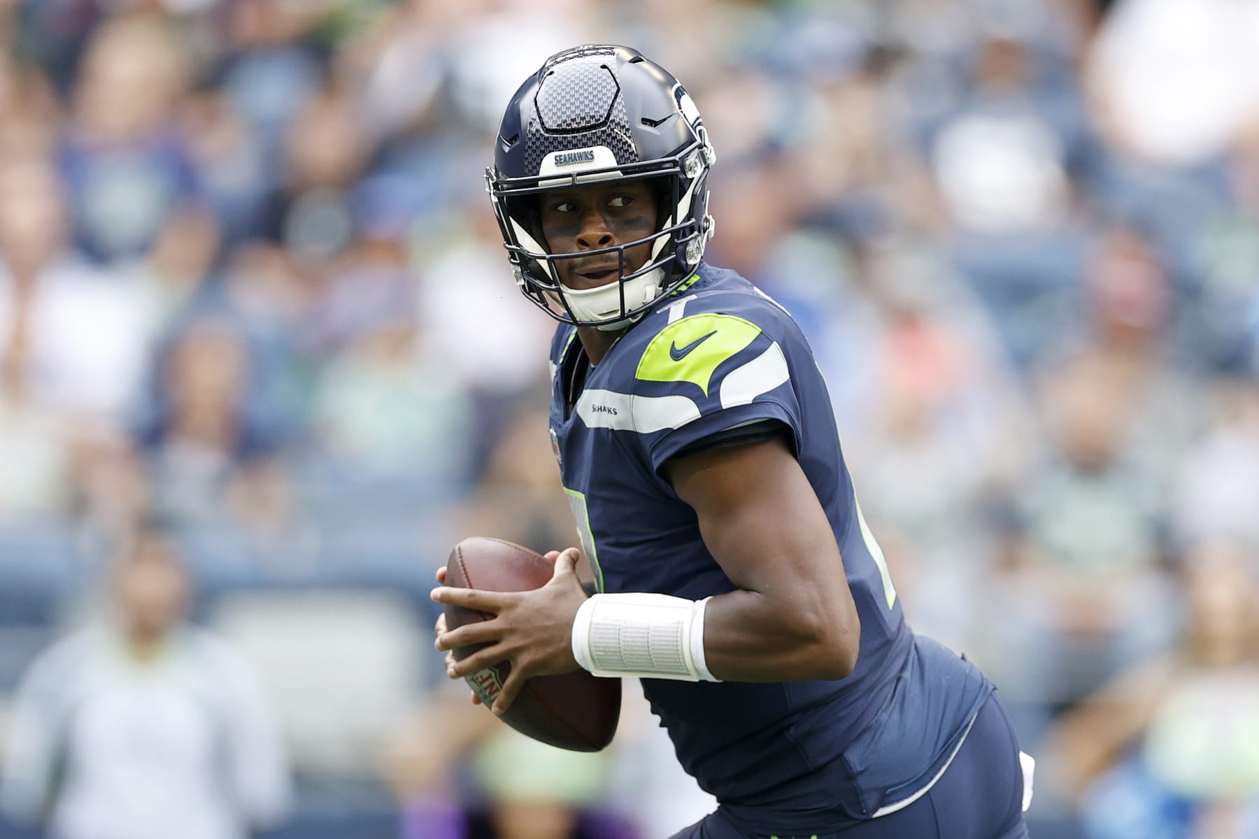 SEATTLE, WASHINGTON - AUGUST 18: Geno Smith #7 of the Seattle Seahawks looks to pass in the first half during the preseason game between the Seattle Seahawks and the Chicago Bears at Lumen Field on August 18, 2022 in Seattle, Washington. (Photo by Steph Chambers/Getty Images)