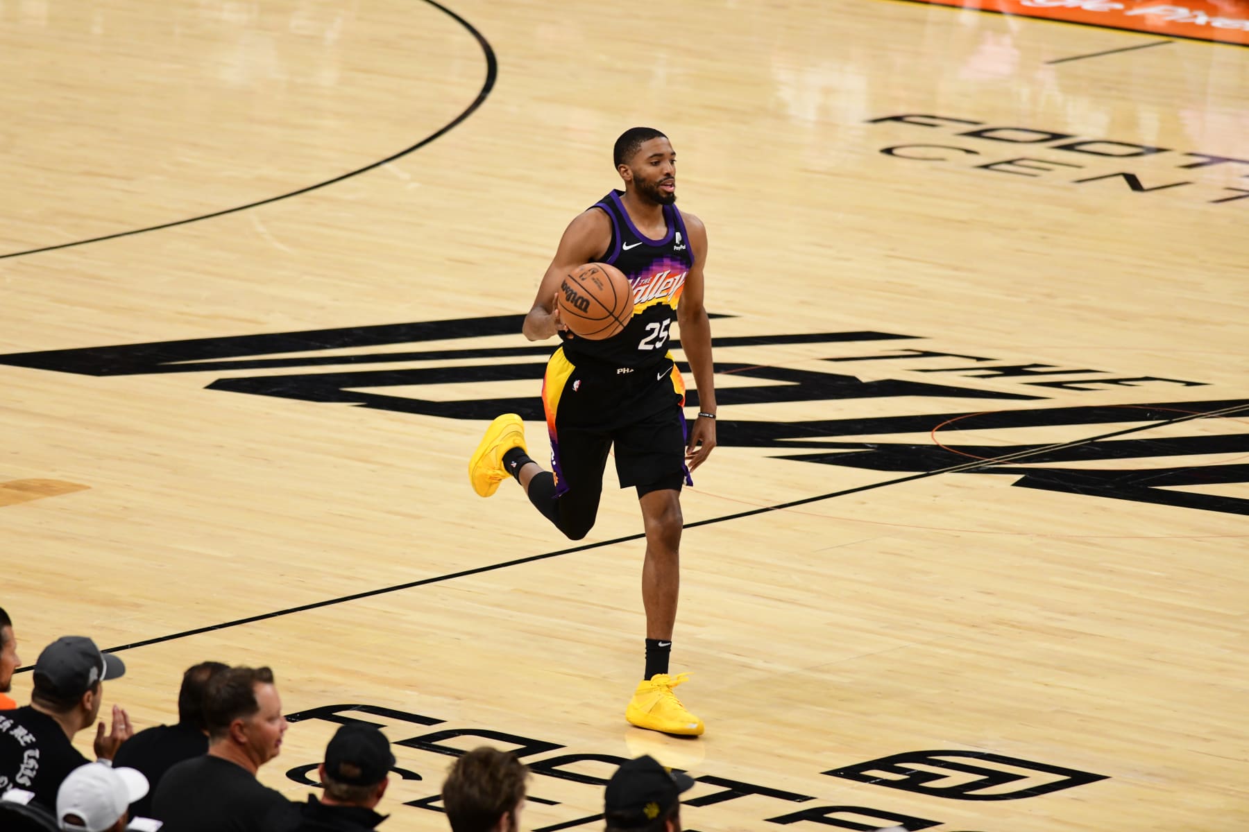 PHOENIX, AZ - MAY 15: Mikal Bridges #25 of the Phoenix Suns dribbles the ball against the Dallas Mavericks during Game 7 of the 2022 NBA Playoffs Western Conference Semifinals on May 15, 2022 at Footprint Center in Phoenix, Arizona. NOTE TO USER: User expressly acknowledges and agrees that, by downloading and or using this photograph, user is consenting to the terms and conditions of the Getty Images License Agreement. Mandatory Copyright Notice: Copyright 2022 NBAE (Photo by Kate Frese/NBAE via Getty Images)