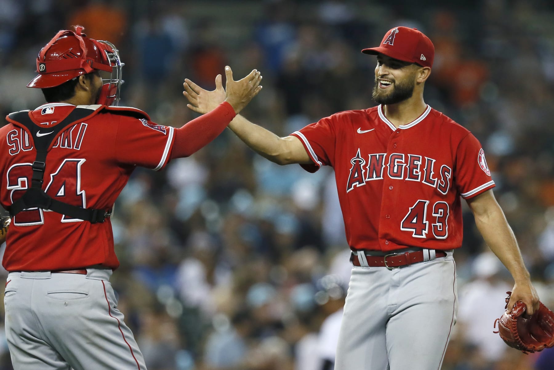 DETROIT, MI -  AUGUST 19:  Starting pitcher Patrick Sandoval #43 of the Los Angeles Angels celebrates with catcher Kurt Suzuki #24 after pitching a four-hitter complete game against the Detroit Tigers at Comerica Park on August 19, 2022, in Detroit, Michigan. The Angels defeated the Tigers 1-0. (Photo by Duane Burleson/Getty Images)