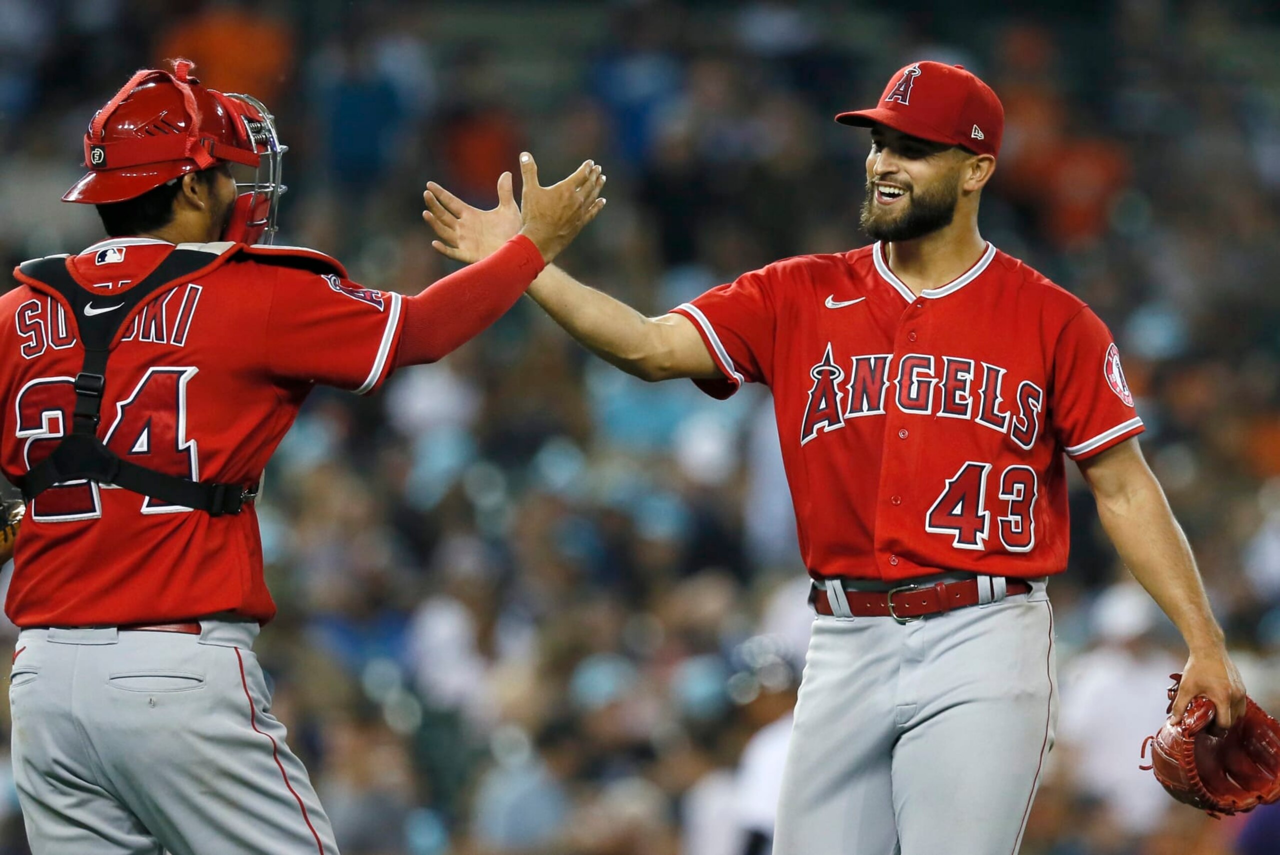 DETROIT, MI -  AUGUST 19:  Starting pitcher Patrick Sandoval #43 of the Los Angeles Angels celebrates with catcher Kurt Suzuki #24 after pitching a four-hitter complete game against the Detroit Tigers at Comerica Park on August 19, 2022, in Detroit, Michigan. The Angels defeated the Tigers 1-0. (Photo by Duane Burleson/Getty Images)