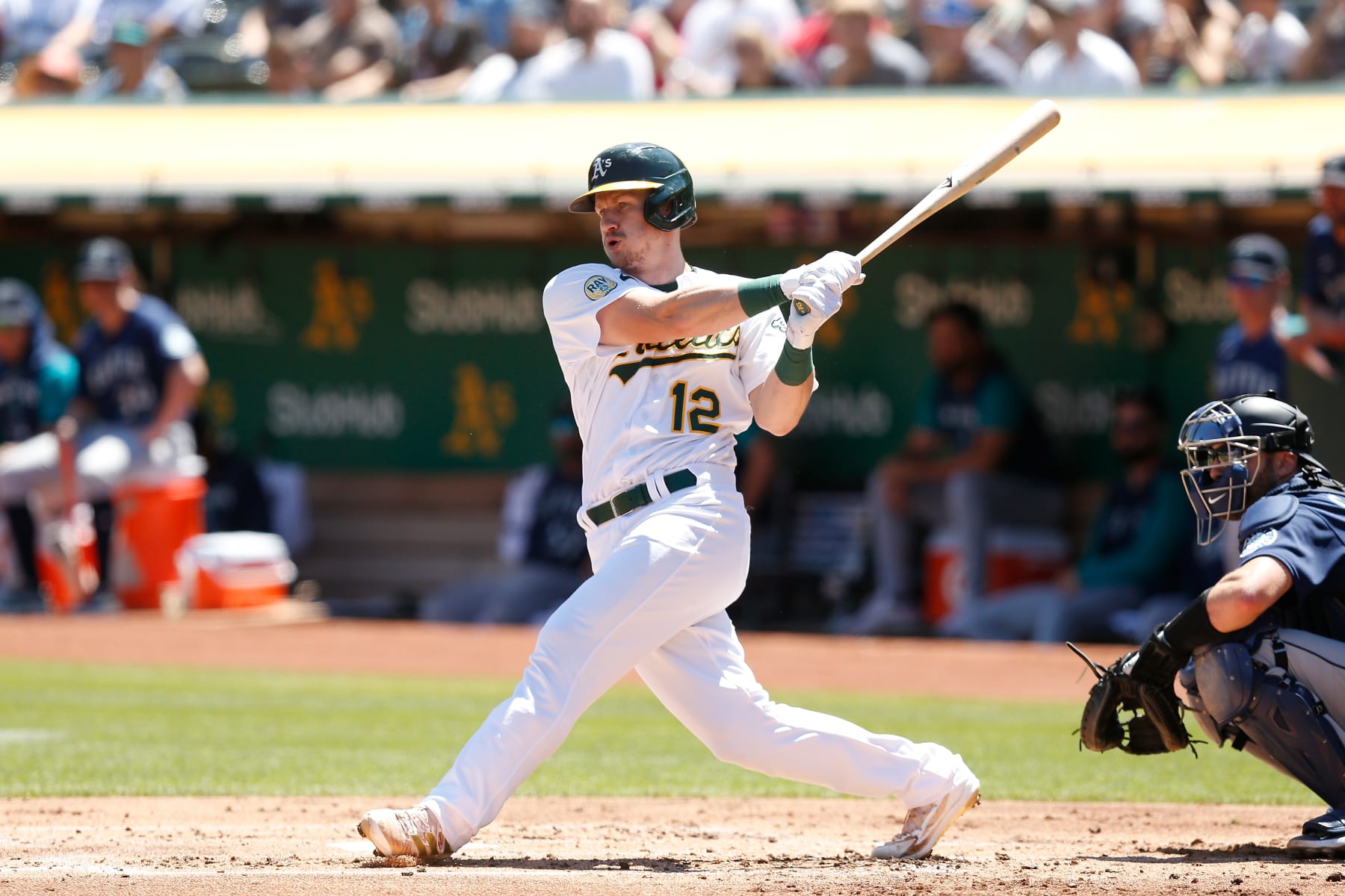 OAKLAND, CALIFORNIA - AUGUST 21: Sean Murphy #12 of the Oakland Athletics hits an RBI double in the bottom of the first inning against the Seattle Mariners at RingCentral Coliseum on August 21, 2022 in Oakland, California. (Photo by Lachlan Cunningham/Getty Images)