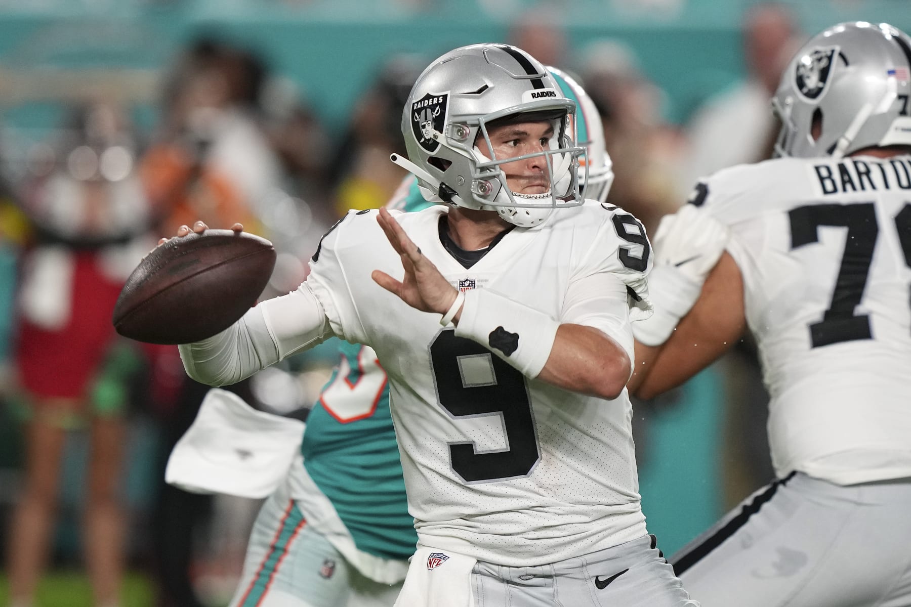 MIAMI GARDENS, FLORIDA - AUGUST 20: Nick Mullens #9 of the Las Vegas Raiders attempts a pass during the second quarter against the Miami Dolphins at Hard Rock Stadium on August 20, 2022 in Miami Gardens, Florida. (Photo by Eric Espada/Getty Images)