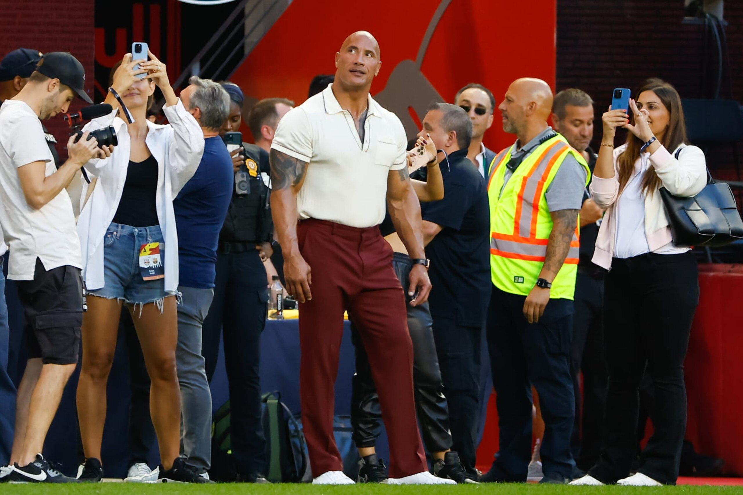 HARRISON, NJ - JULY 30:  Actor Dwayne Johnson watches his wife Lauren Hashian sing during halftime of the game between FC Barcelona and the New York Red Bulls on July 30, 2022 at Red Bull Arena in Harrison, New Jersey.   (Photo by Rich Graessle/Icon Sportswire via Getty Images)