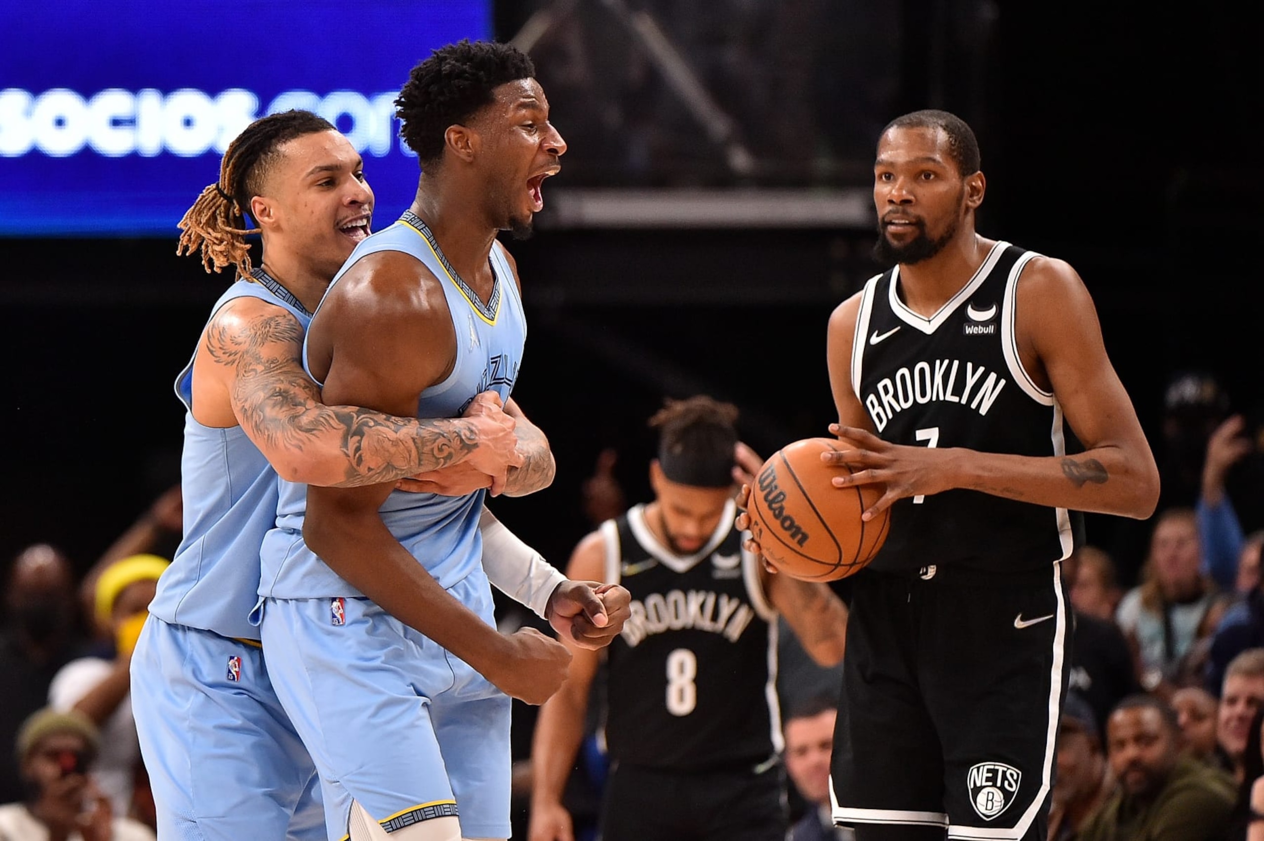 MEMPHIS, TENNESSEE - MARCH 23: Brandon Clarke #15 of the Memphis Grizzlies and Jaren Jackson Jr. #13 of the Memphis Grizzlies celebrate as Kevin Durant #7 of the Brooklyn Nets looks on during the second half at FedExForum on March 23, 2022 in Memphis, Tennessee. NOTE TO USER: User expressly acknowledges and agrees that , by downloading and or using this photograph, User is consenting to the terms and conditions of the Getty Images License Agreement. (Photo by Justin Ford/Getty Images) MEMPHIS, TENNESSEE - MARCH 23: Brandon Clarke #15 of the Memphis Grizzlies and Jaren Jackson Jr. #13 of the Memphis Grizzlies celebrate as Kevin Durant #7 of the Brooklyn Nets looks on during the second half at FedExForum on March 23, 2022 in Memphis, Tennessee. NOTE TO USER: User expressly acknowledges and agrees that , by downloading and or using this photograph, User is consenting to the terms and conditions of the Getty Images License Agreement. (Photo by Justin Ford/Getty Images)