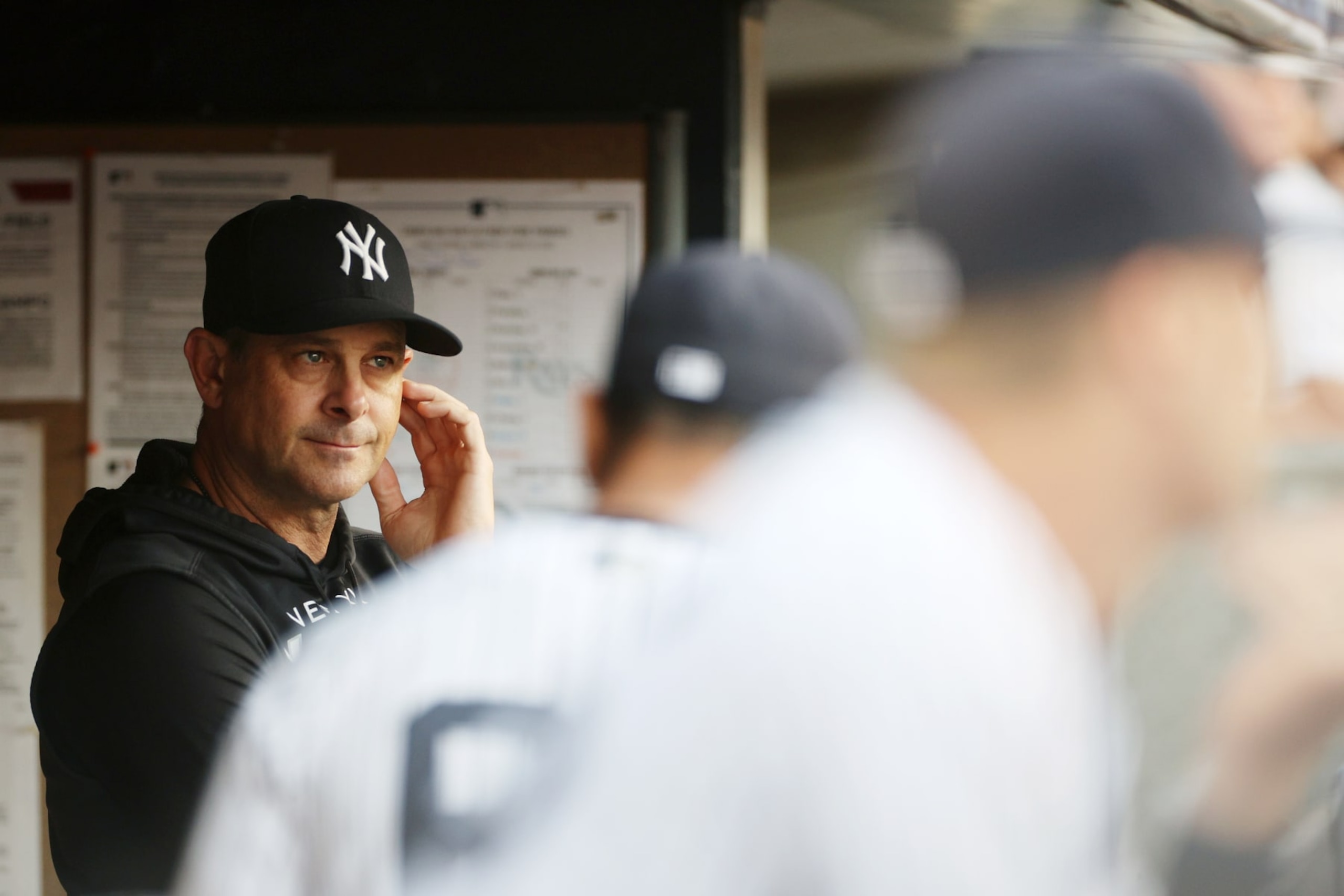 NEW YORK, NEW YORK - AUGUST 16: Manager Aaron Boone #17 of the New York Yankees looks on from the dugout during the first inning against the Tampa Bay Rays at Yankee Stadium on August 16, 2022 in the Bronx borough of New York City. (Photo by Sarah Stier/Getty Images) NEW YORK, NEW YORK - AUGUST 16: Manager Aaron Boone #17 of the New York Yankees looks on from the dugout during the first inning against the Tampa Bay Rays at Yankee Stadium on August 16, 2022 in the Bronx borough of New York City. (Photo by Sarah Stier/Getty Images)