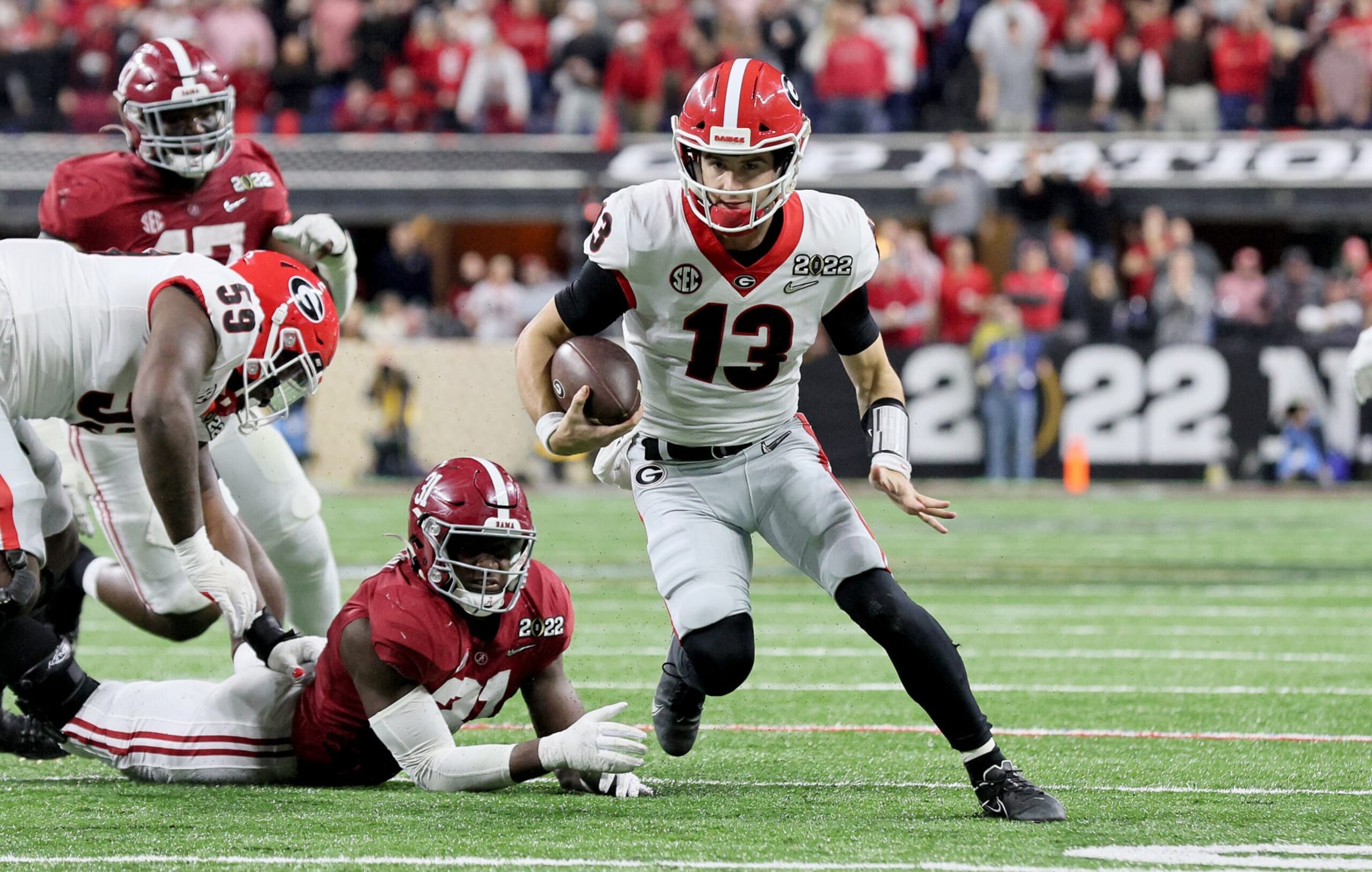 INDIANAPOLIS, INDIANA - JANUARY 10: Stetson Bennett #13 of the the Georgia Bulldogs against the Alabama Crimson Tide at Lucas Oil Stadium on January 10, 2022 in Indianapolis, Indiana. (Photo by Andy Lyons/Getty Images) INDIANAPOLIS, INDIANA - JANUARY 10: Stetson Bennett #13 of the the Georgia Bulldogs against the Alabama Crimson Tide at Lucas Oil Stadium on January 10, 2022 in Indianapolis, Indiana. (Photo by Andy Lyons/Getty Images)