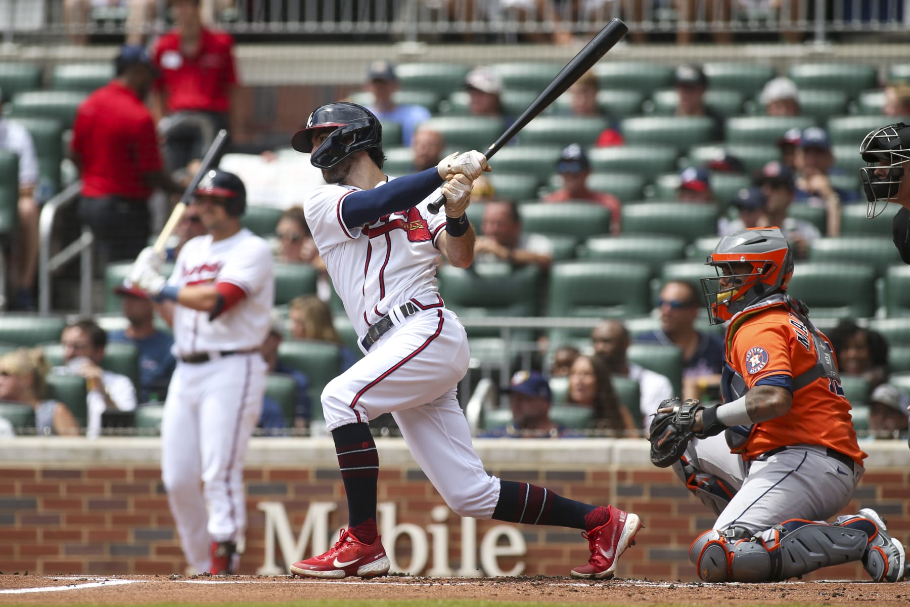 ATLANTA, GA - AUGUST 21: Dansby Swanson #7 of the Atlanta Braves hits a single against the Houston Astros in the first inning at Truist Park on August 21, 2022 in Atlanta, Georgia. (Photo by Brett Davis/Getty Images)