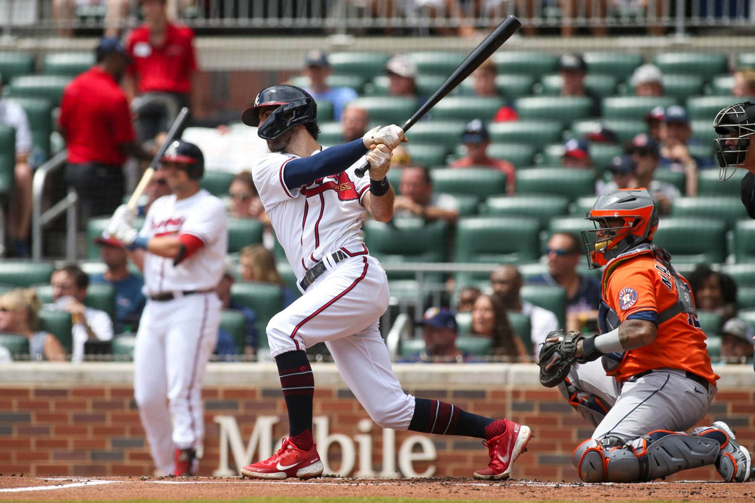 ATLANTA, GA - AUGUST 21: Dansby Swanson #7 of the Atlanta Braves hits a single against the Houston Astros in the first inning at Truist Park on August 21, 2022 in Atlanta, Georgia. (Photo by Brett Davis/Getty Images)