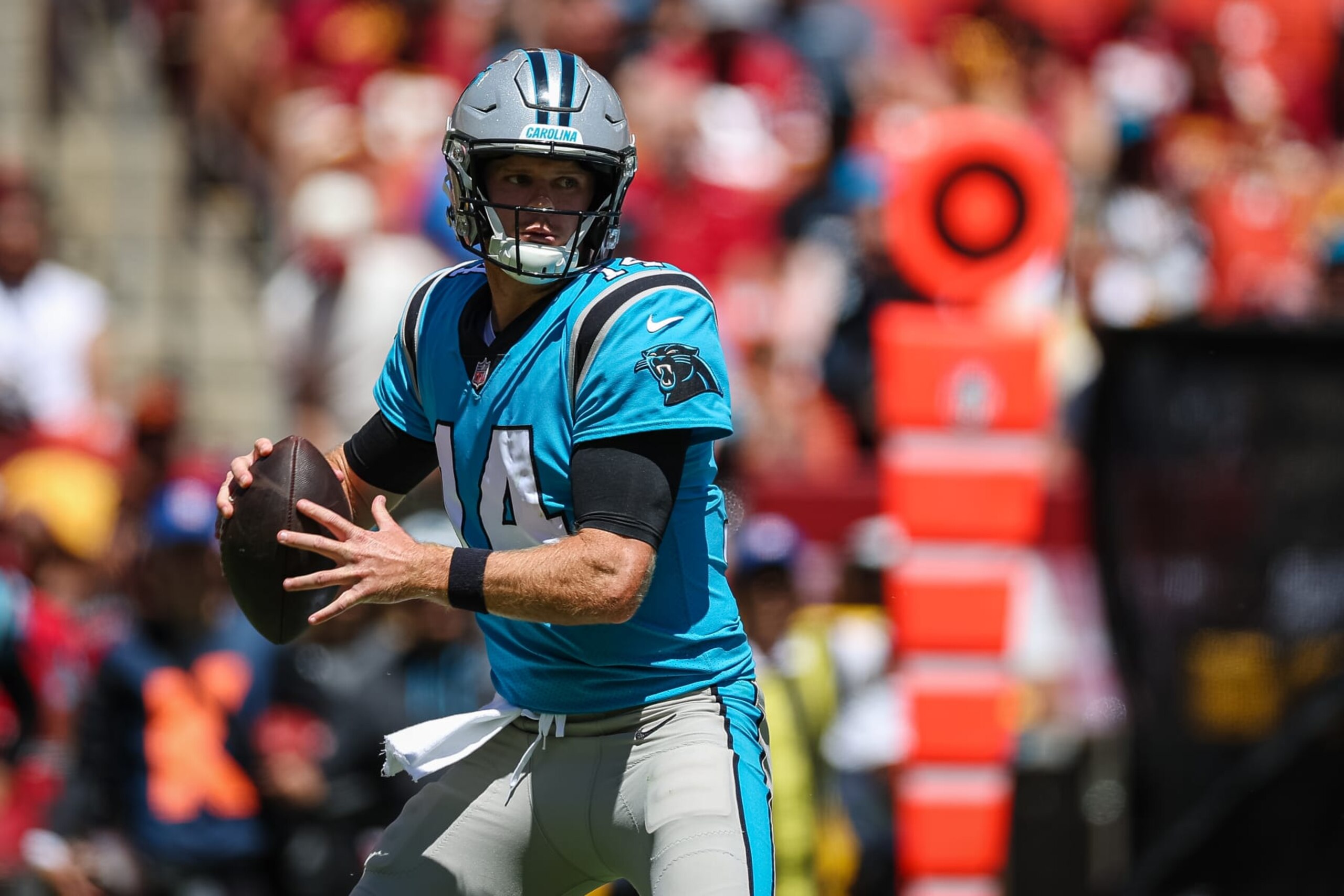 LANDOVER, MD - AUGUST 13: Sam Darnold #14 of the Carolina Panthers looks to pass against the Washington Commanders during the first half of the preseason game at FedExField on August 13, 2022 in Landover, Maryland. (Photo by Scott Taetsch/Getty Images)
