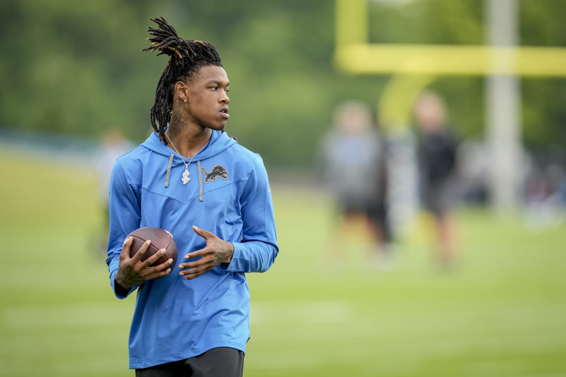 ALLEN PARK, MICHIGAN - JULY 27: Jameson Williams #18 of the Detroit Lions looks on during the Detroit Lions Training Camp on July 27, 2022 at the Lions Headquarters and Training Facility in Allen Park, Michigan. (Photo by Nic Antaya/Getty Images)