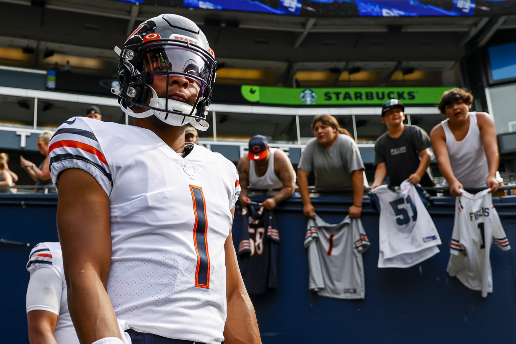 SEATTLE, WASHINGTON - AUGUST 18: Justin Fields #1 of the Chicago Bears walks on to the field prior to the preseason game against the Seattle Seahawks at Lumen Field on August 18, 2022 in Seattle, Washington. (Photo by Steph Chambers/Getty Images)