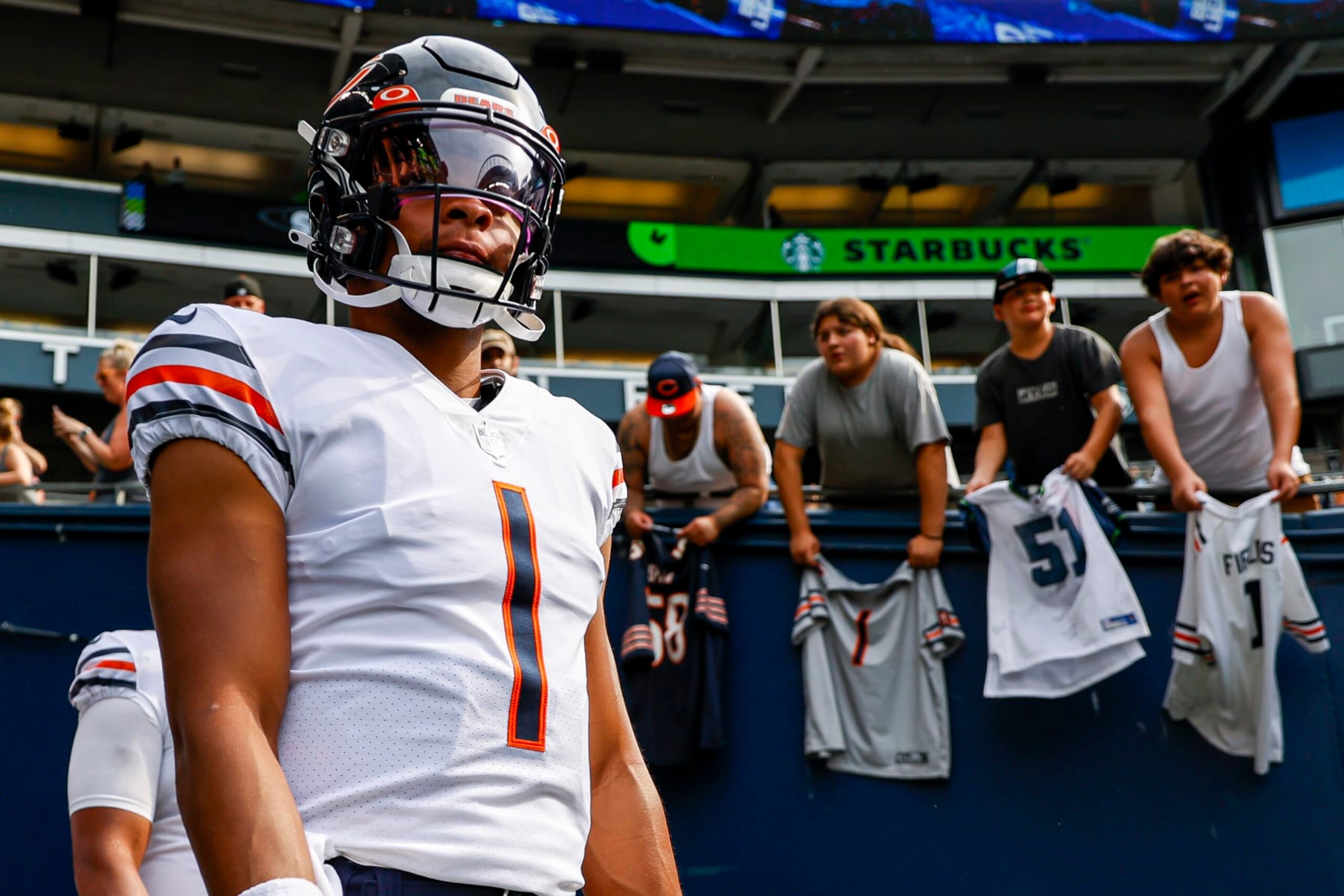 SEATTLE, WASHINGTON - AUGUST 18: Justin Fields #1 of the Chicago Bears walks on to the field prior to the preseason game against the Seattle Seahawks at Lumen Field on August 18, 2022 in Seattle, Washington. (Photo by Steph Chambers/Getty Images)