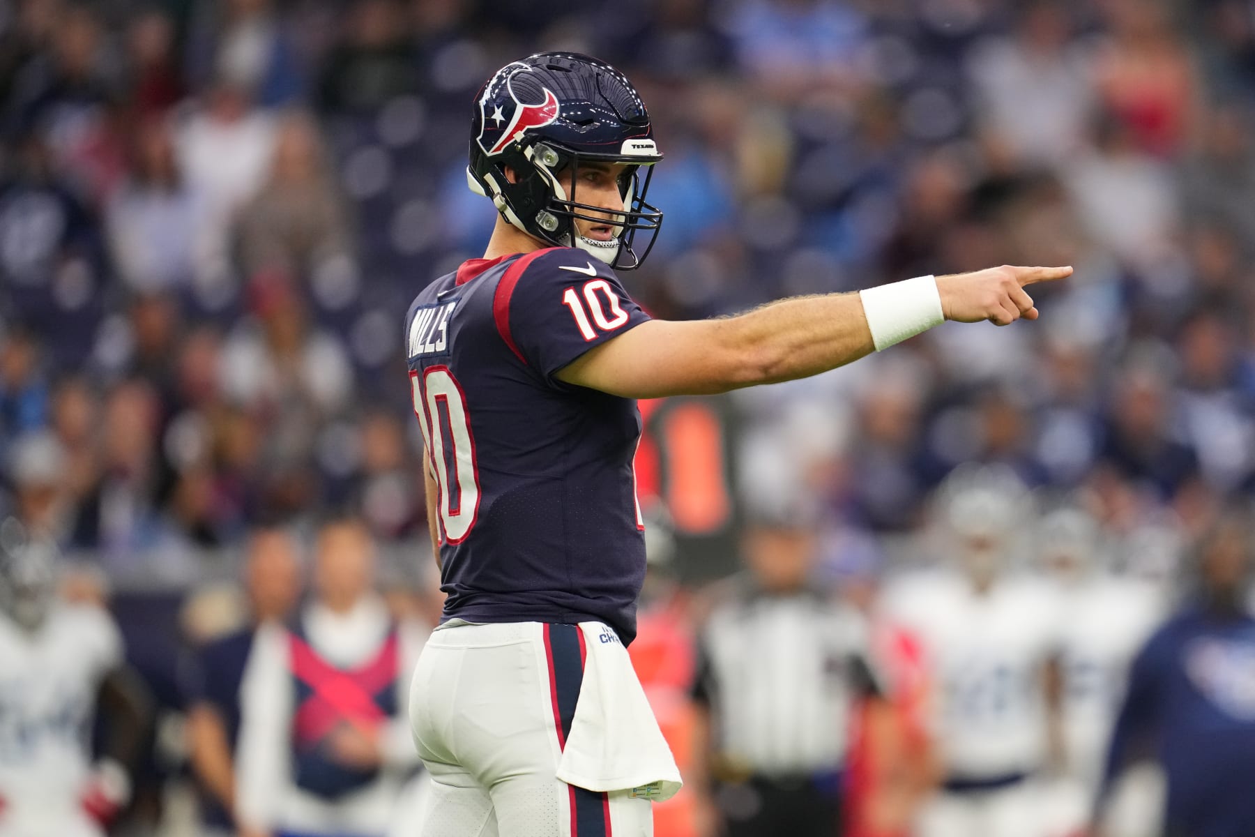 HOUSTON, TEXAS - JANUARY 09: Davis Mills #10 of the Houston Texans gets set against the Tennessee Titans during an NFL game at NRG Stadium on January 09, 2022 in Houston, Texas. (Photo by Cooper Neill/Getty Images)