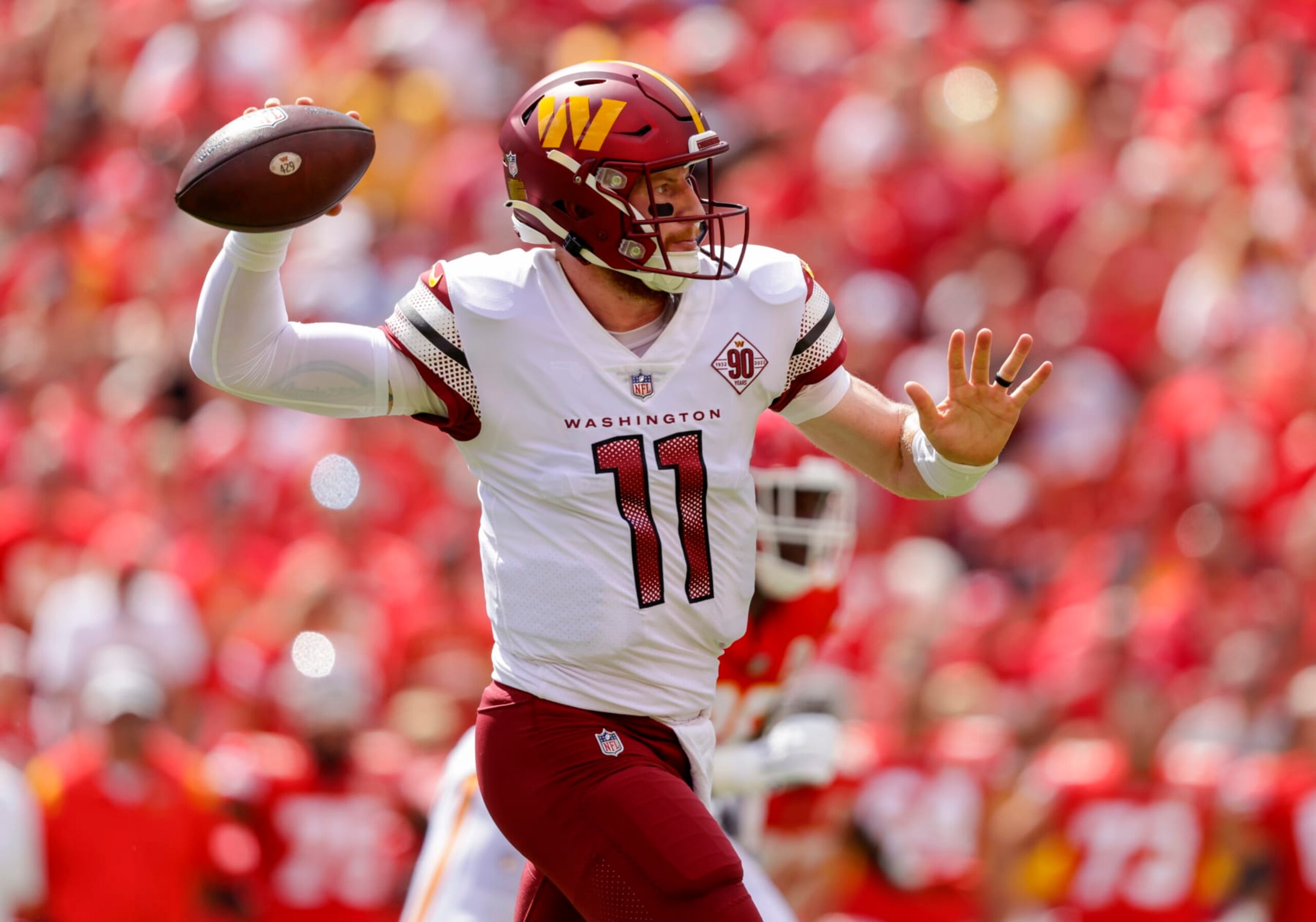 KANSAS CITY, MO - AUGUST 20: Carson Wentz #11 of the Washington Commanders throws a first quarter pass against the Kansas City Chiefs at Arrowhead Stadium on August 20, 2022 in Kansas City, Missouri. (Photo by David Eulitt/Getty Images)