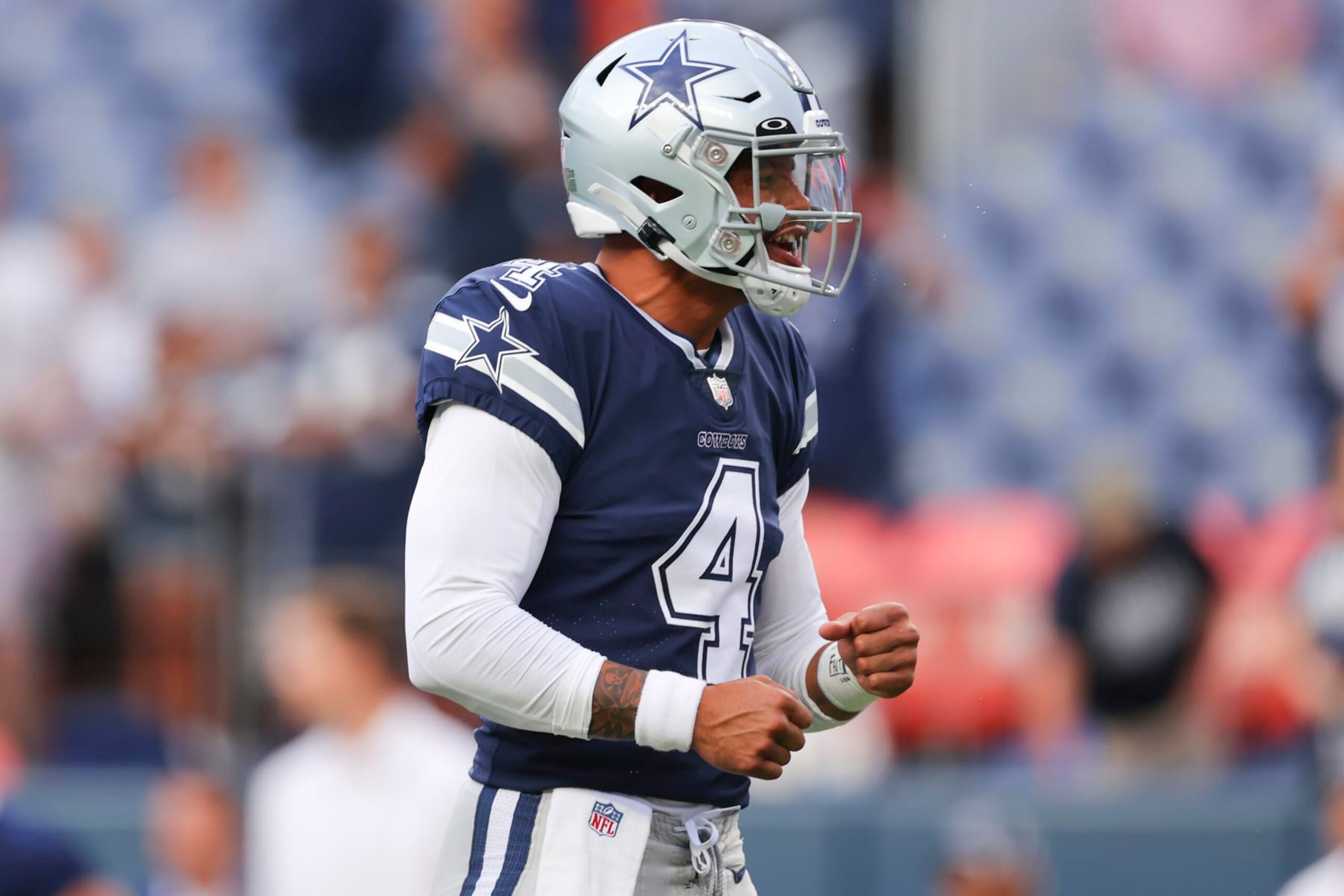DENVER, CO - AUGUST 13: Dak Prescott #4 of the Dallas Cowboys reacts before the game against the Denver Broncos at Empower Field At Mile High on August 13, 2022 in Denver, Colorado. (Photo by C. Morgan Engel/Getty Images)
