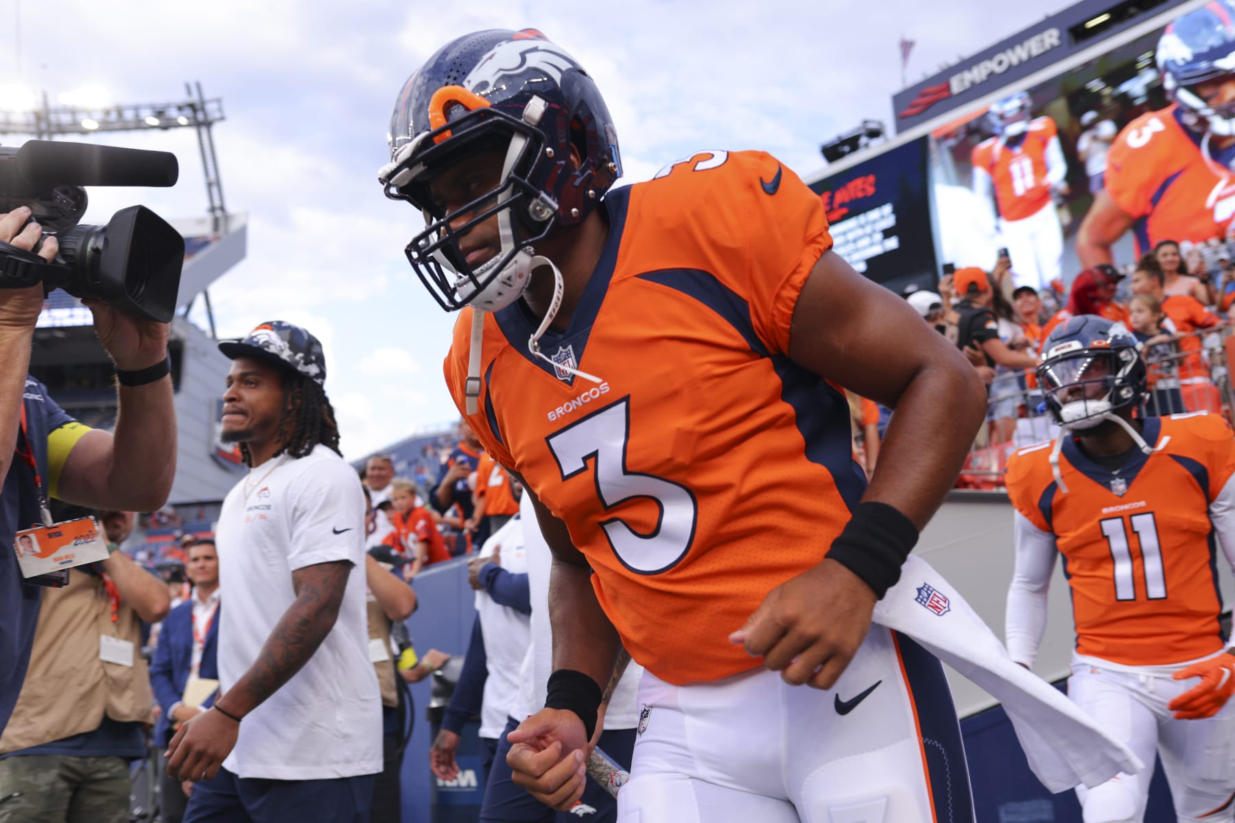 DENVER, CO - AUGUST 13: Russell Wilson #3 of the Denver Broncos runs onto the field for warm-up before the game against the Dallas Cowboys at Empower Field At Mile High on August 13, 2022 in Denver, Colorado. (Photo by C. Morgan Engel/Getty Images)