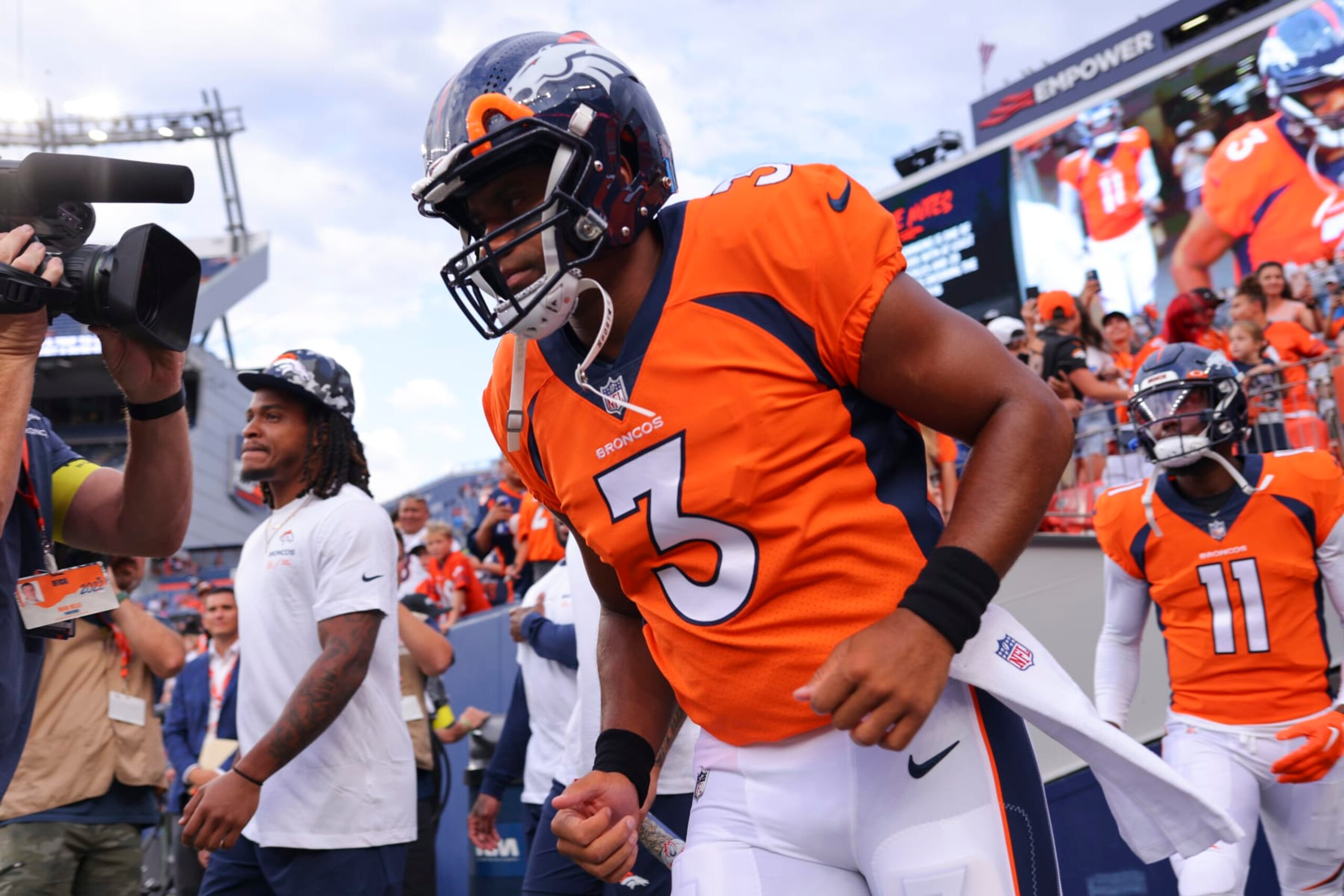 DENVER, CO - AUGUST 13: Russell Wilson #3 of the Denver Broncos runs onto the field for warm-up before the game against the Dallas Cowboys at Empower Field At Mile High on August 13, 2022 in Denver, Colorado. (Photo by C. Morgan Engel/Getty Images)