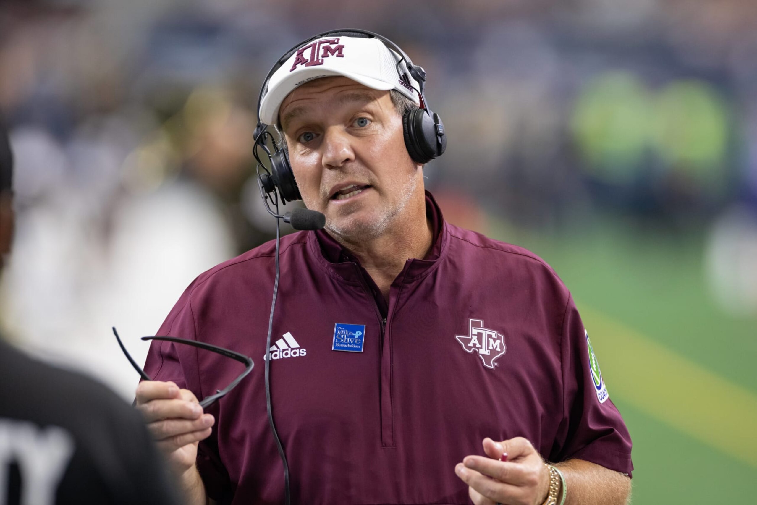 ARLINGTON, TX - SEPTEMBER 25: Texas A&M Aggies head coach Jimbo Fisher is interviewed on the field during the Southwest Classic college football game between the Texas A&M Aggies and Arkansas Razorbacks on September 25, 2021 at AT&T Stadium in Arlington, TX. (Photo by Matthew Visinsky/Icon Sportswire via Getty Images) ARLINGTON, TX - SEPTEMBER 25: Texas A&M Aggies head coach Jimbo Fisher is interviewed on the field during the Southwest Classic college football game between the Texas A&M Aggies and Arkansas Razorbacks on September 25, 2021 at AT&T Stadium in Arlington, TX. (Photo by Matthew Visinsky/Icon Sportswire via Getty Images)