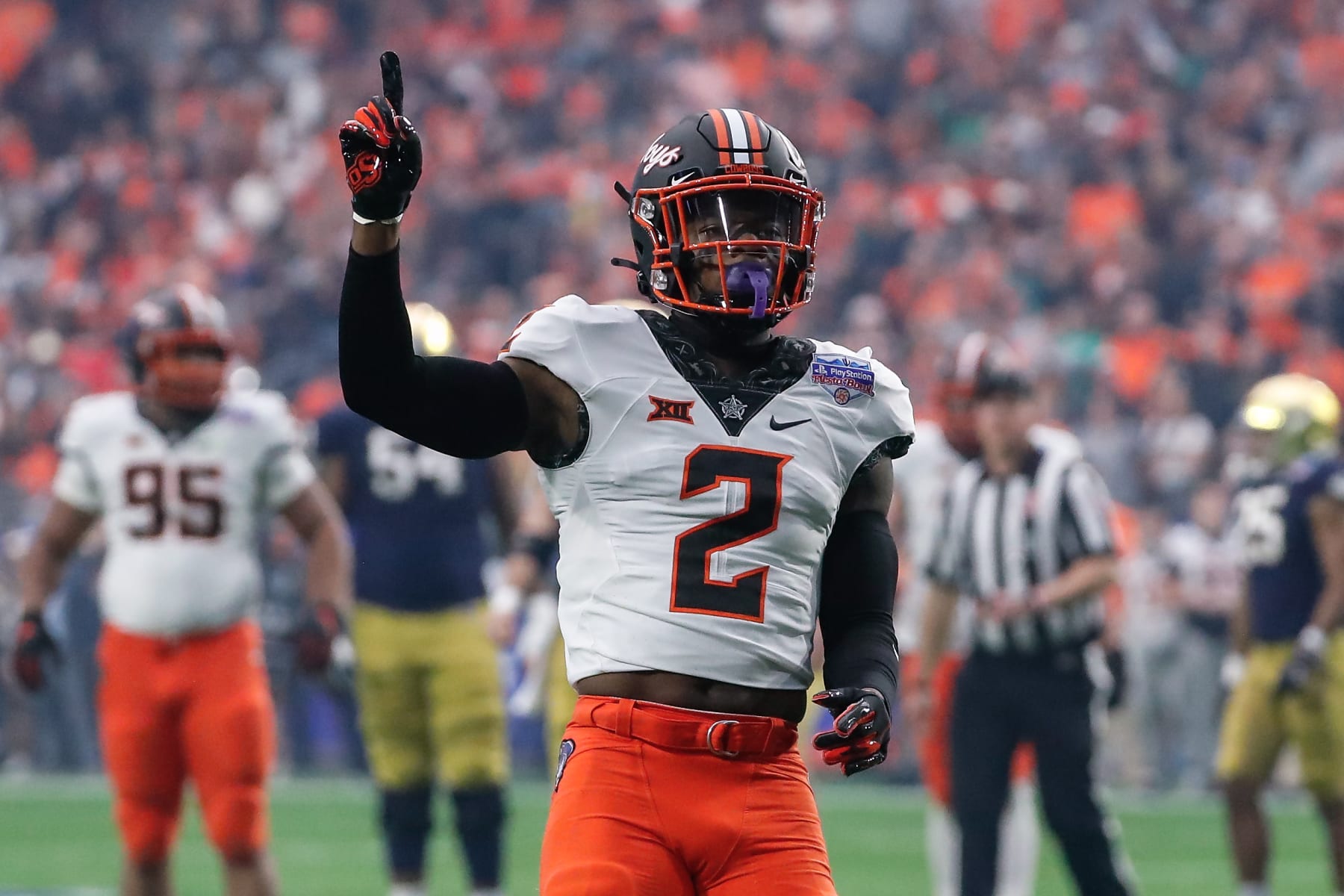 GLENDALE, AZ - JANUARY 01:  Oklahoma State Cowboys safety Tanner McCalister (2) reacts to a big play during the PlayStation Fiesta Bowl college football bowl game between the Notre Dame Fighting Irish and the Oklahoma State Cowboys on January 1, 2022 at State Farm Stadium in Glendale, Arizona. (Photo by Kevin Abele/Icon Sportswire via Getty Images)