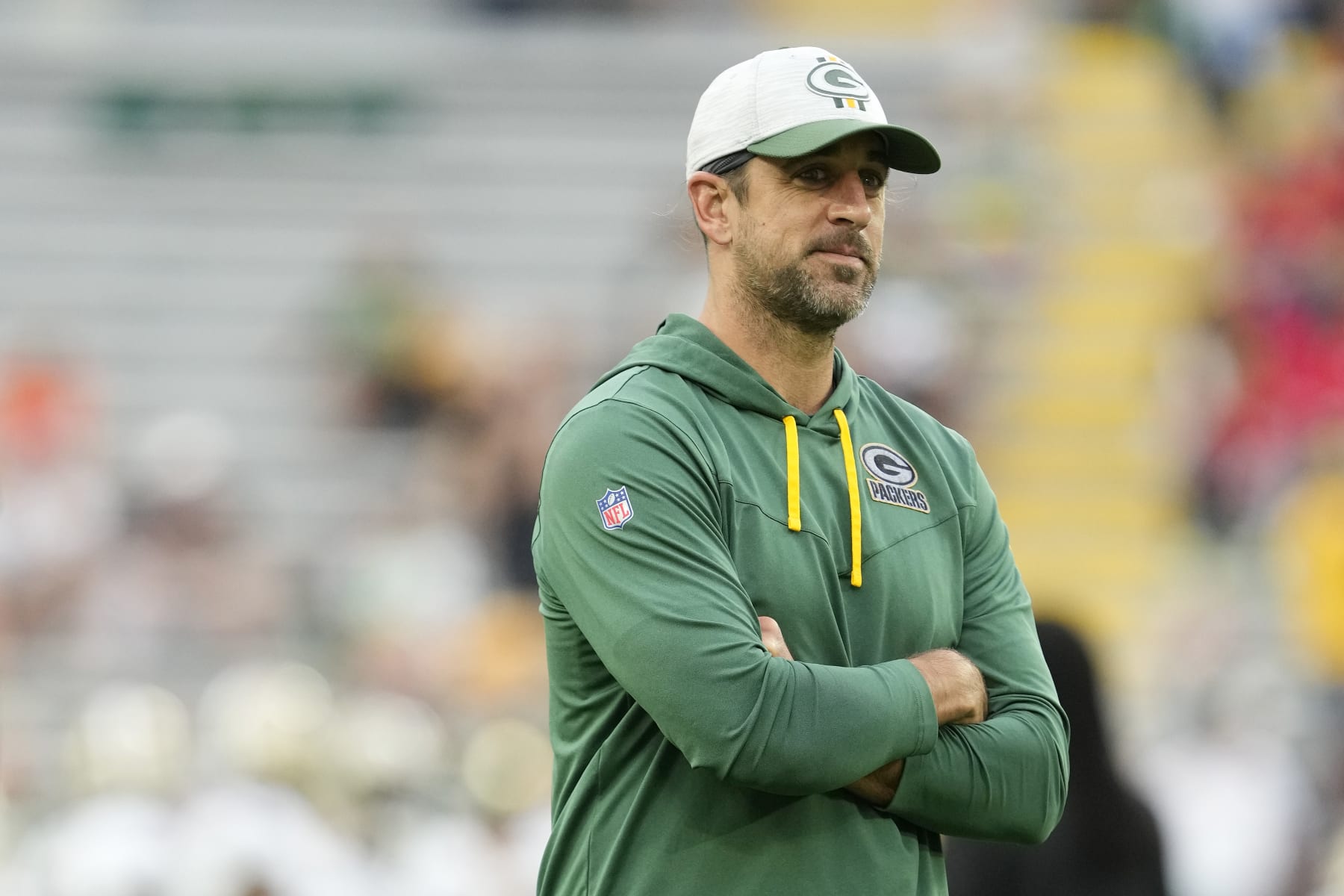 GREEN BAY, WISCONSIN - AUGUST 19: Aaron Rodgers #12 of the Green Bay Packers looks on before a preseason game against the New Orleans Saints at Lambeau Field on August 19, 2022 in Green Bay, Wisconsin. (Photo by Patrick McDermott/Getty Images)