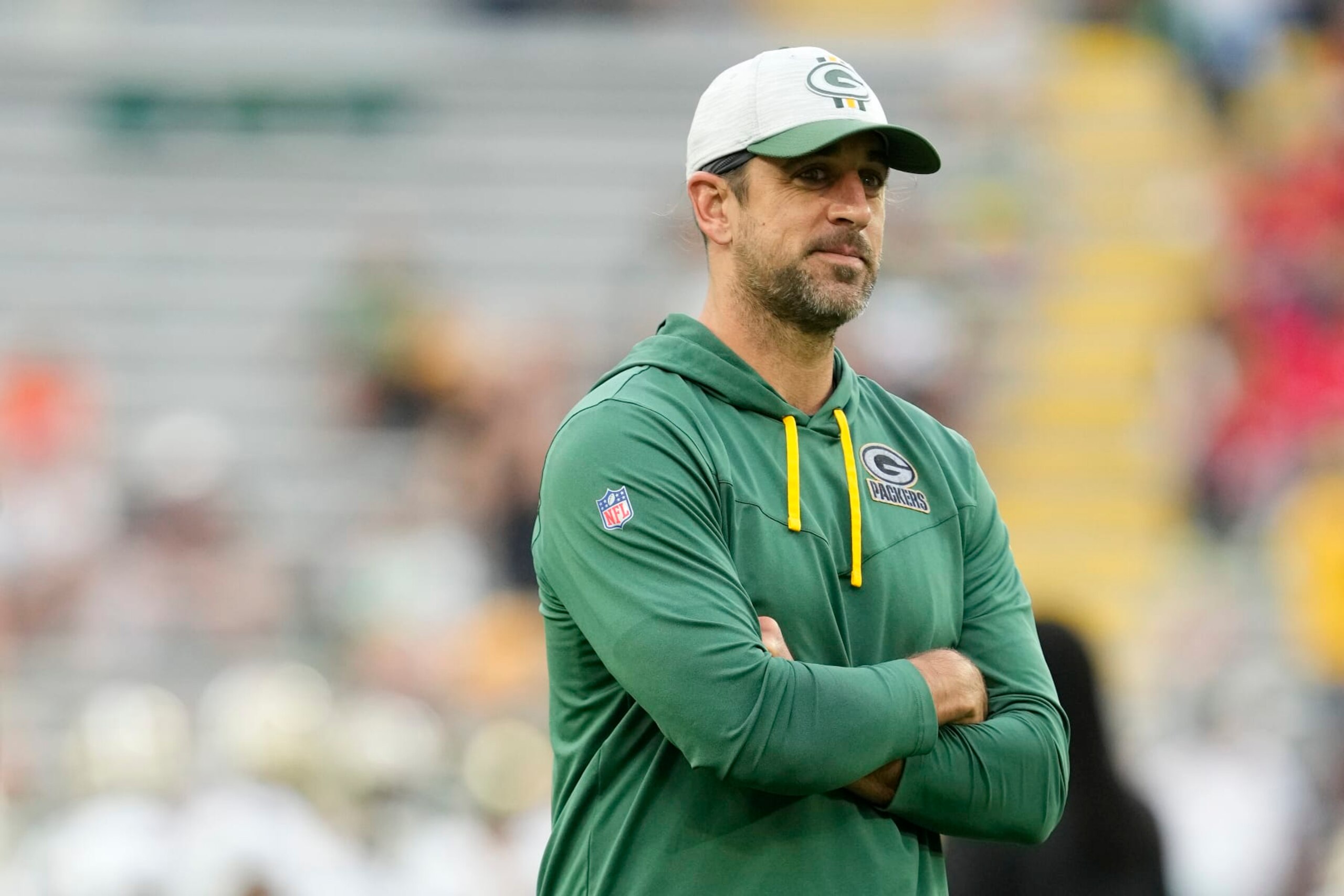 GREEN BAY, WISCONSIN - AUGUST 19: Aaron Rodgers #12 of the Green Bay Packers looks on before a preseason game against the New Orleans Saints at Lambeau Field on August 19, 2022 in Green Bay, Wisconsin. (Photo by Patrick McDermott/Getty Images)