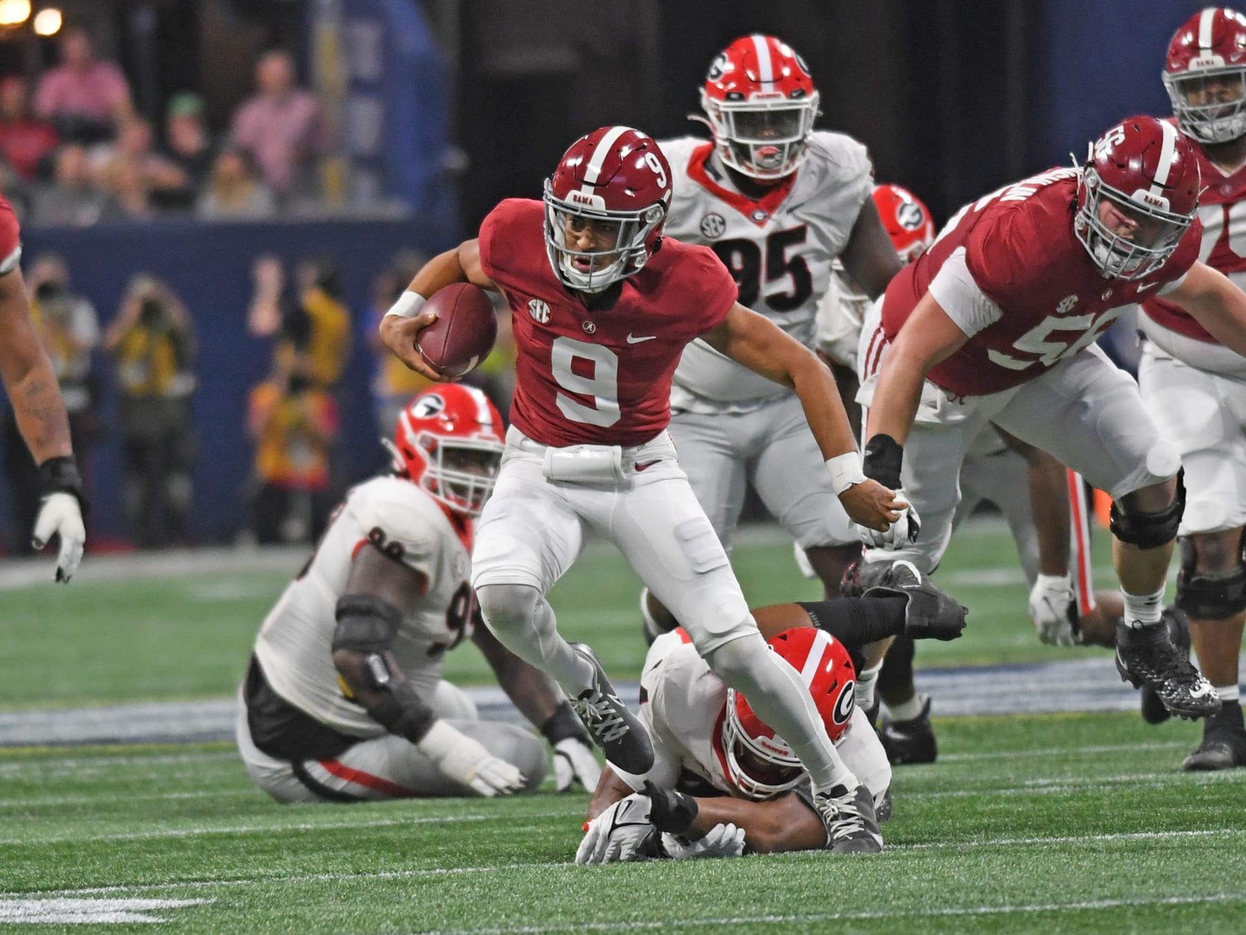 ATLANTA, GA - DECEMBER 04: Alabama Crimson Tide Quarterback Bryce Young (9) rushes the ball during the SEC Championship game between the Alabama Crimson Tide and the Georgia Bulldogs on December 04, 2021, at Mercedes-Benz Stadium in Atlanta, Ga. (Photo by Jeffrey Vest/Icon Sportswire via Getty Images)